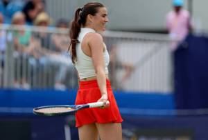 Katy Dunne smiles on court at the Lexus Surbiton Trophy