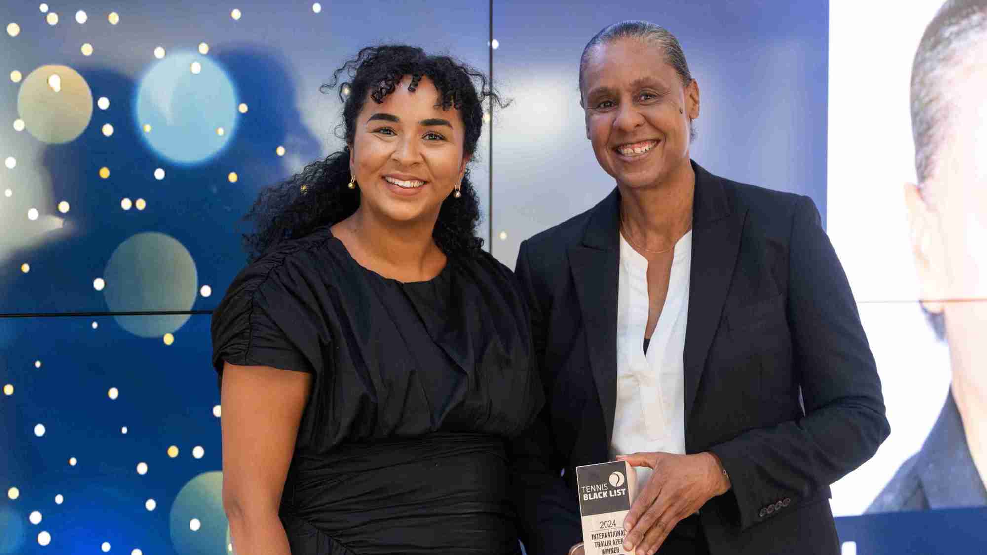 Two of the International Trailblazer Winners at the Tennis Black List smiling while holding their awards