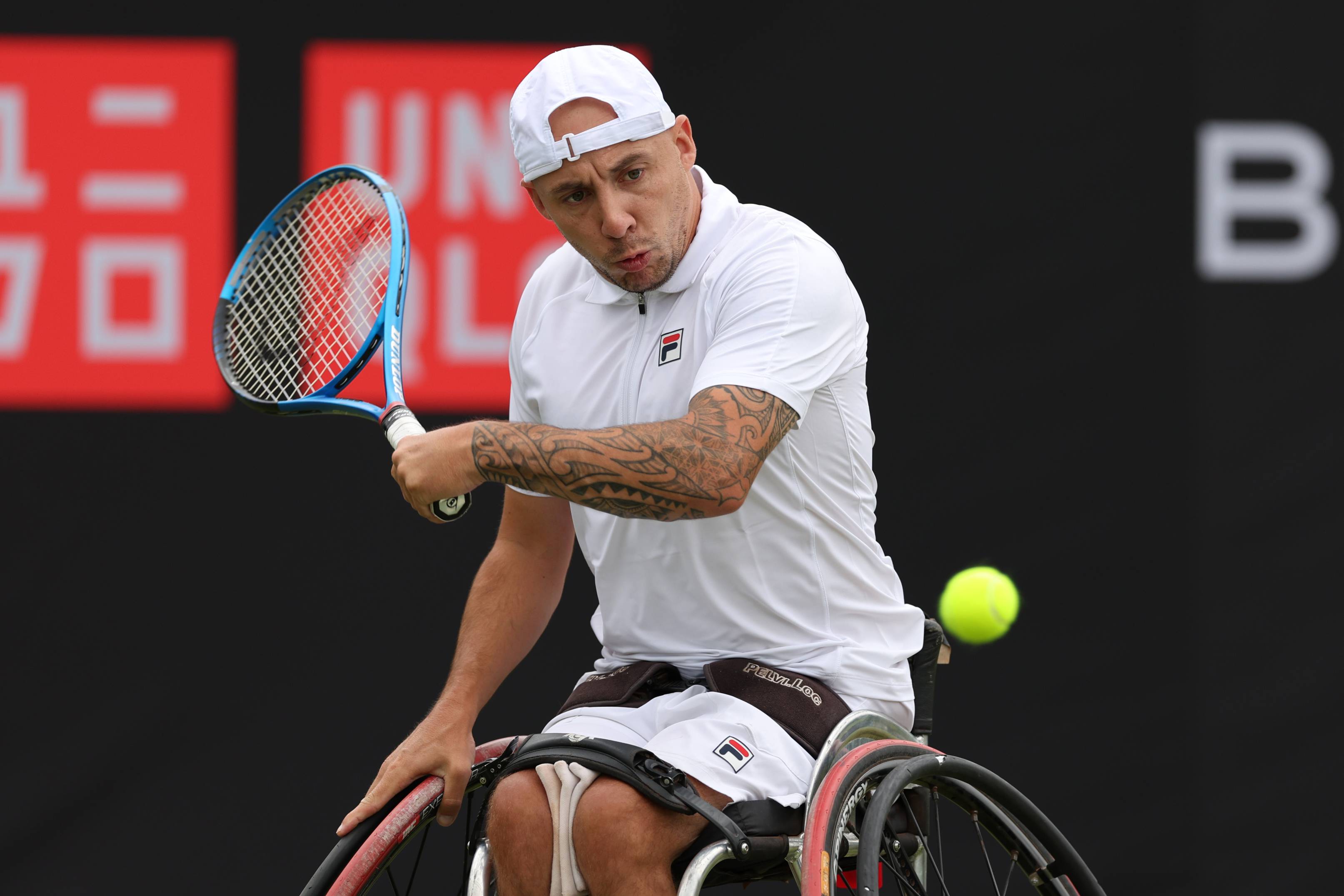 Quad tennis player Andy Lapthorne preparing to hit a backhand on court during a match on the UNIQLO Wheelchair Tennis Tour