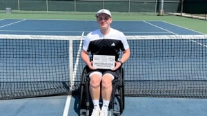 Ben Bartram holding the 2025 men's wheelchair singles title at the Cougar Open 