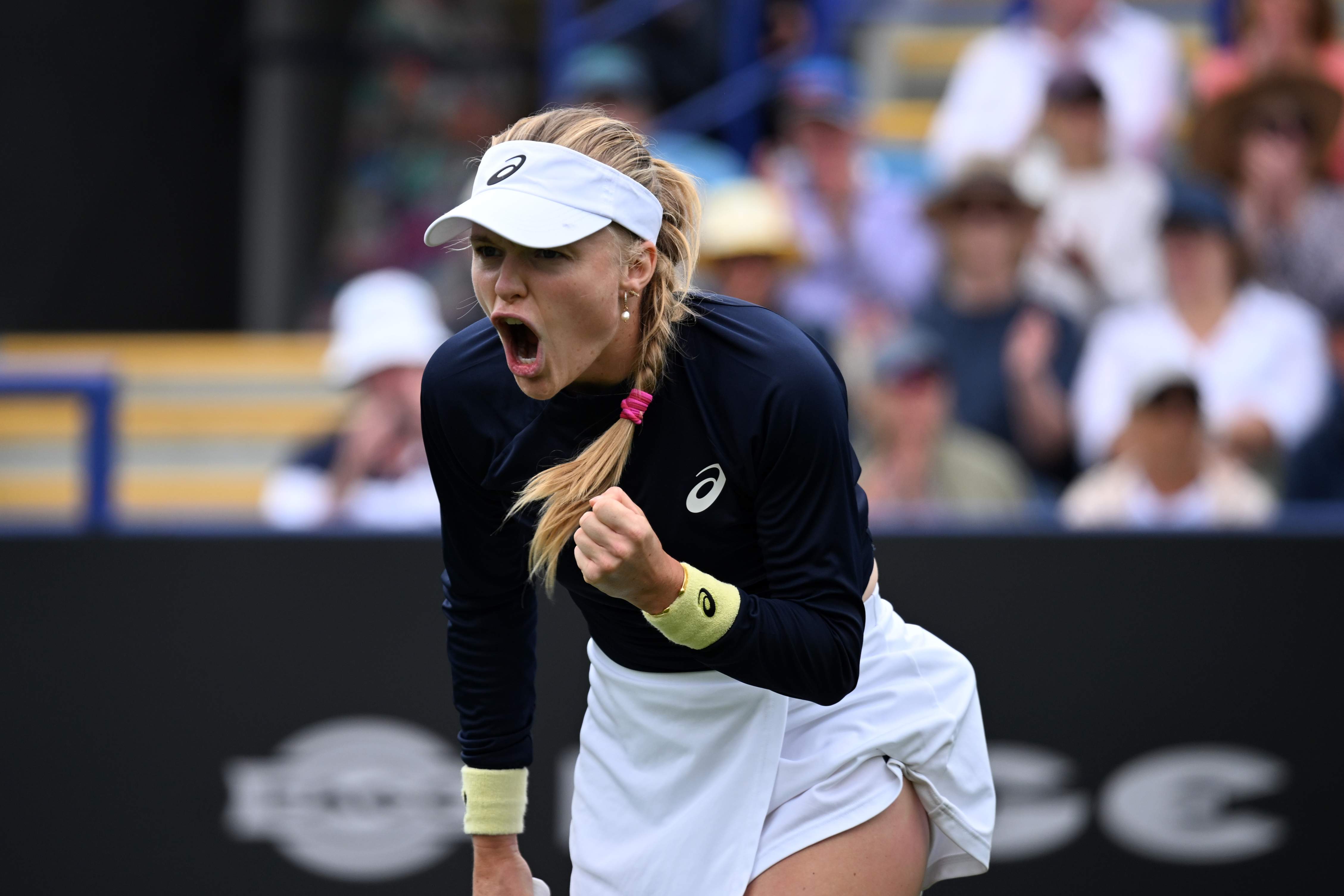 Harriet Dart roars in celebration after winning a point at the Lexus Eastbourne Open
