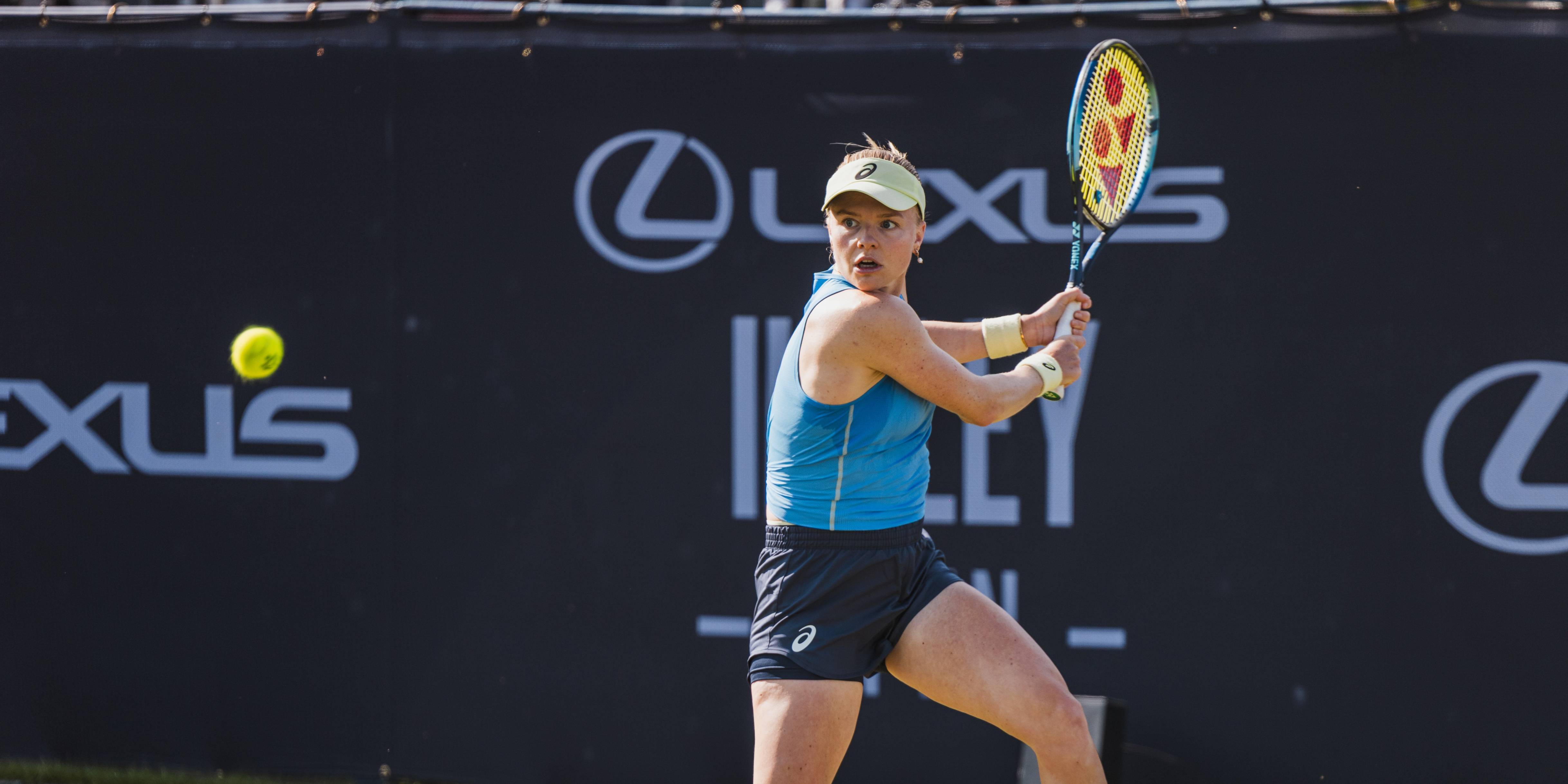 British tennis player Harriet Dart preparing to hit a backhand on court at the Lexus Ilkley Open as a tennis ball comes towards her