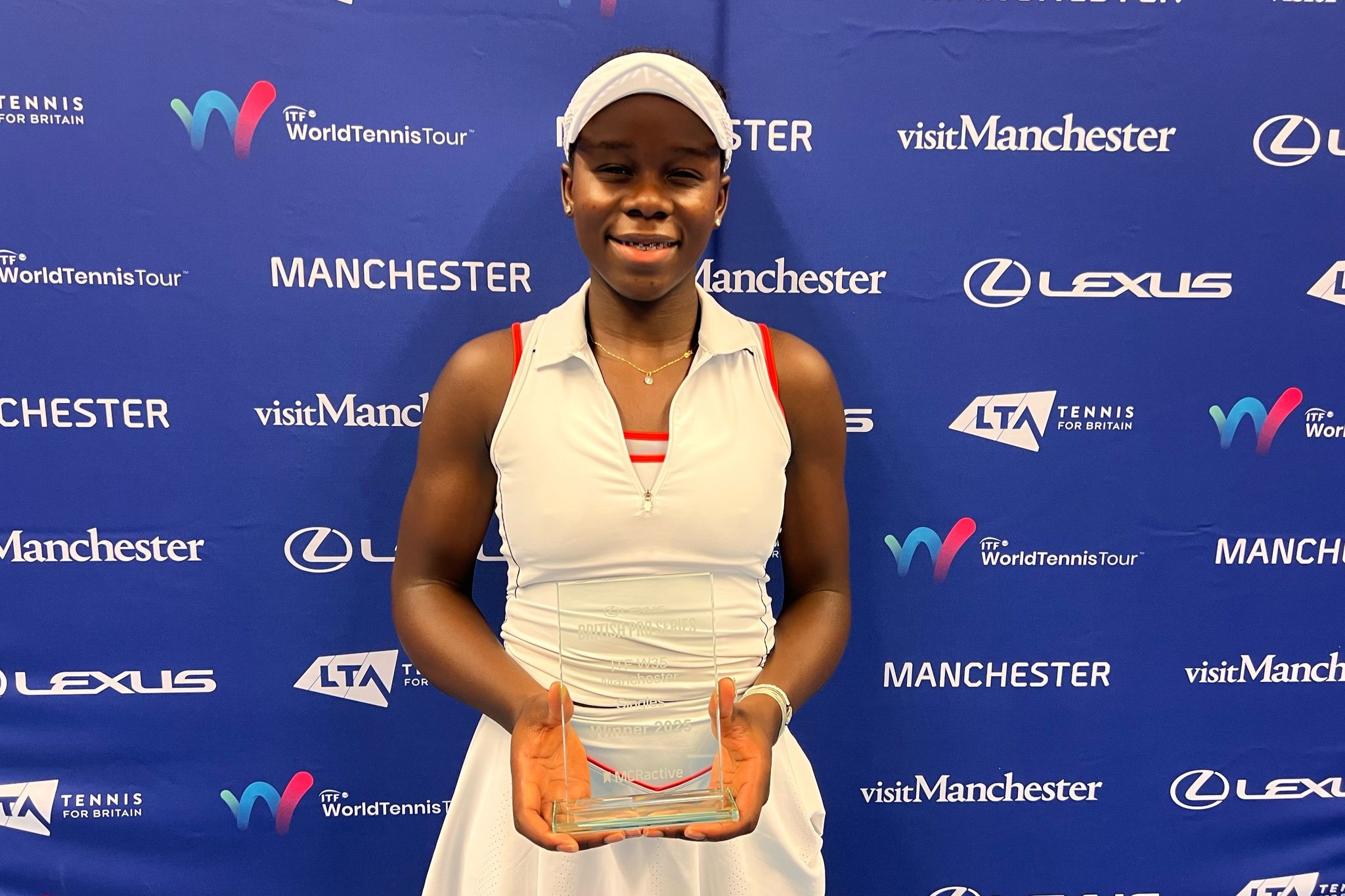 Victoria Mboku - singles champion at the Lexus GB Pro Series Manchester - holding her trophy after winning