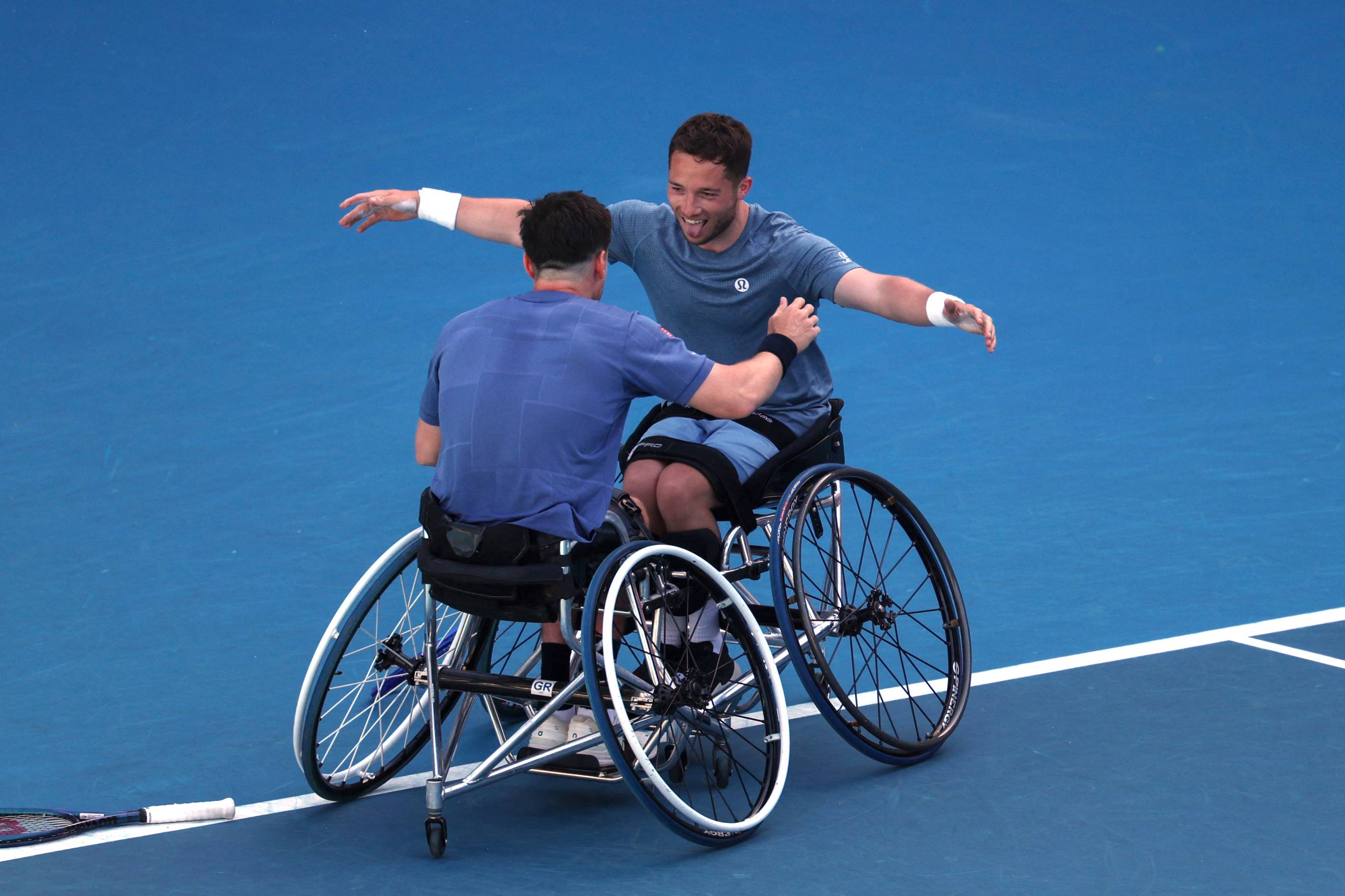 Alfie Hewett and Gordon Reid hug after wining their sixth successive Australian Open doubles title in 2025
