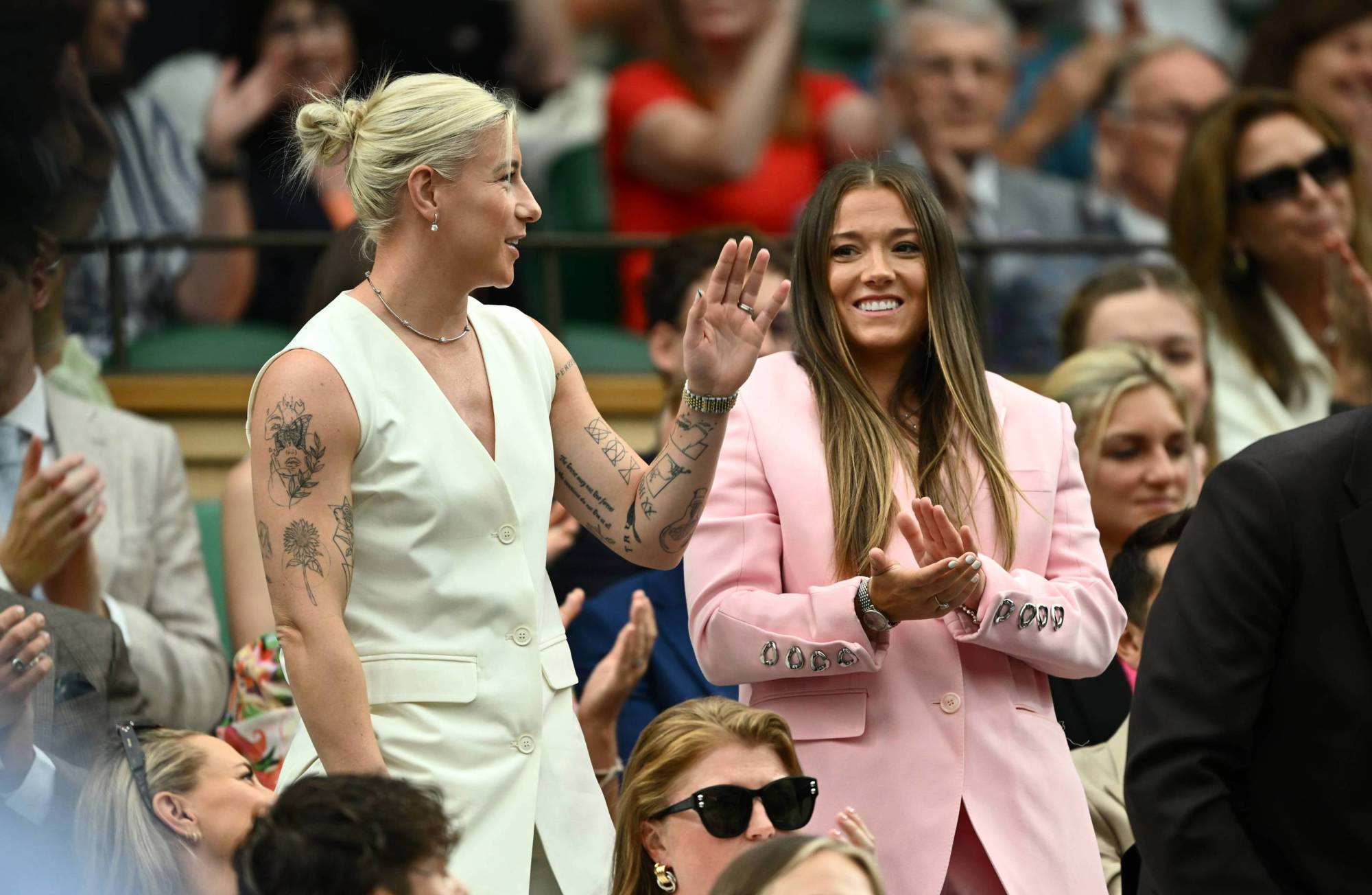 Lionnesses Beth England and Fran Kirby wave to the fans on arrival at the Royal Box on Centre Court