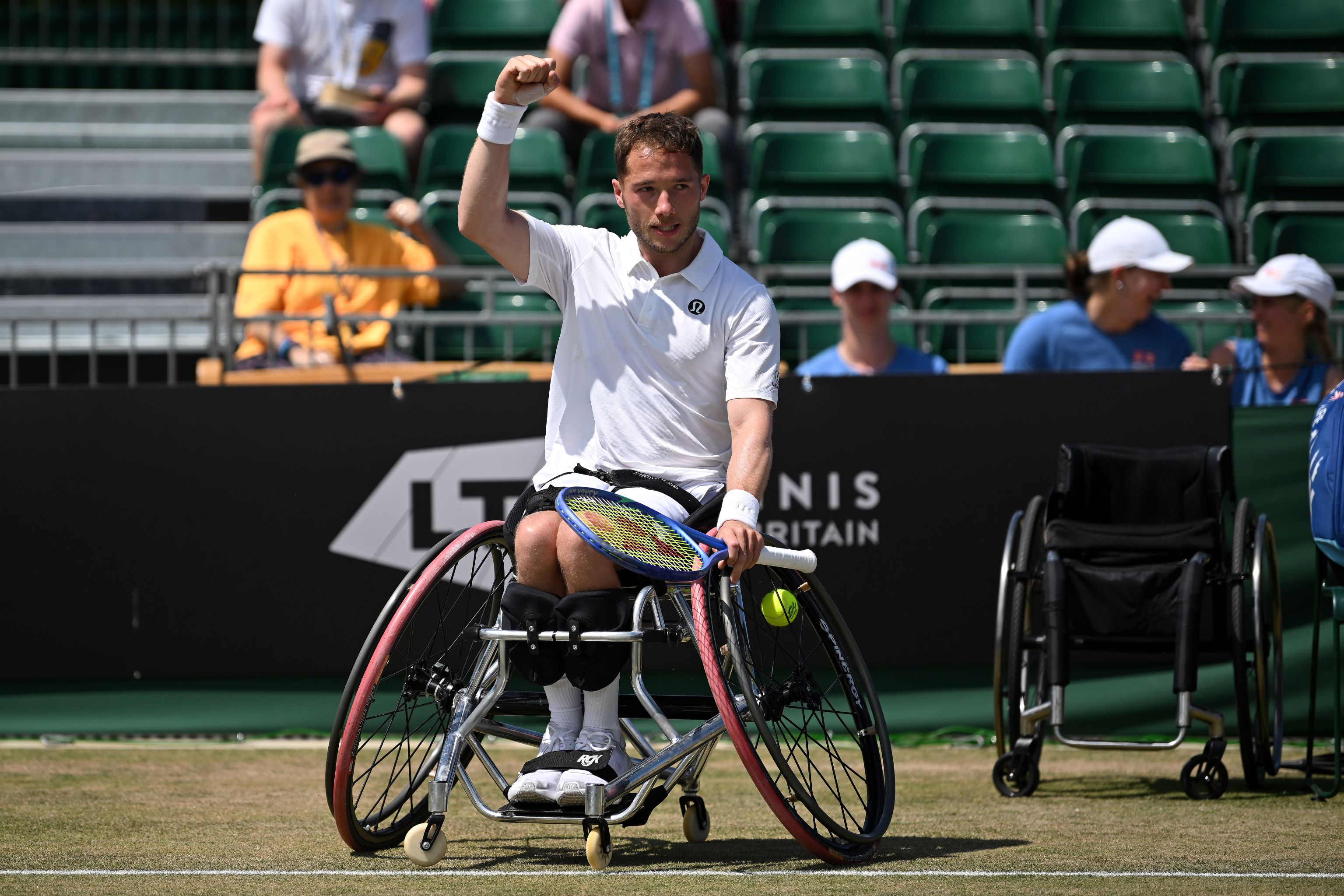 Alfie Hewett raises a fist in celebration after winning the Lexus British Open final