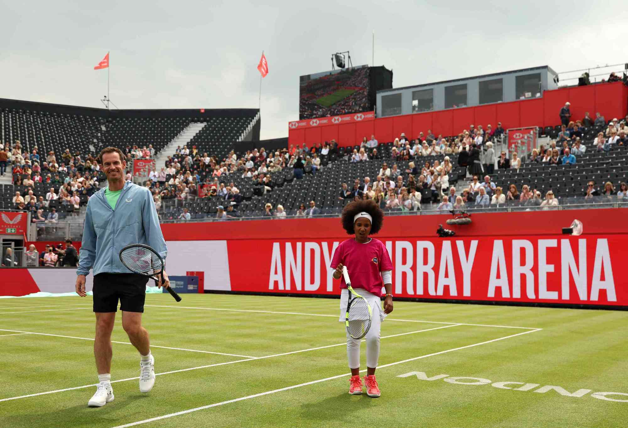 Andy Murray stood on court next to Gloria from the Queen's Club Foundation during the unveiling of the Andy Murray Arena