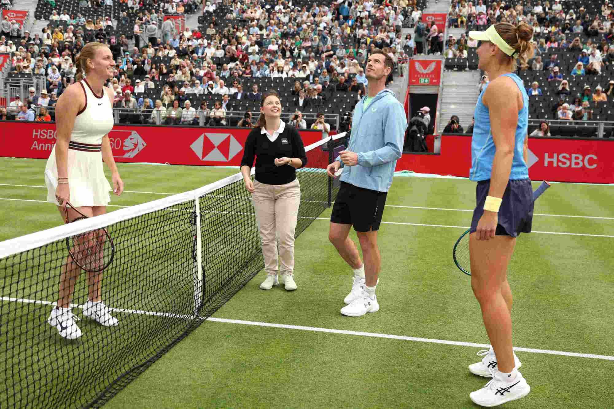 Andy Murray stood on court at the HSBC Championships doing the coin toss for Beatriz Haddad Maia and Petra Kvitova