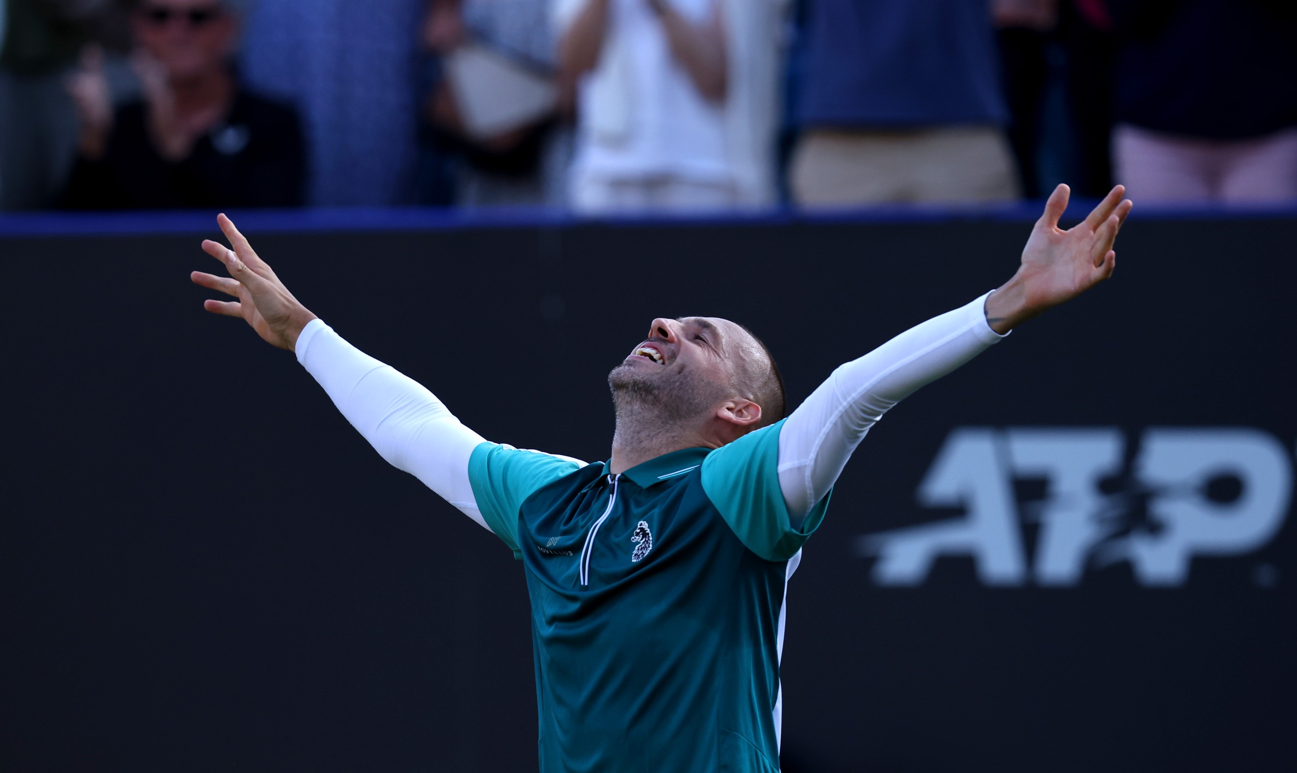 Dan Evans celebrates a second round win over Tommy Paul at the Lexus Eastbourne Open