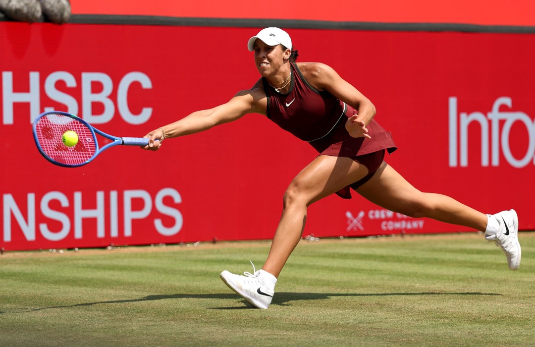 Madison Keys reaching for a forehand on the grass at the HSBC Championships