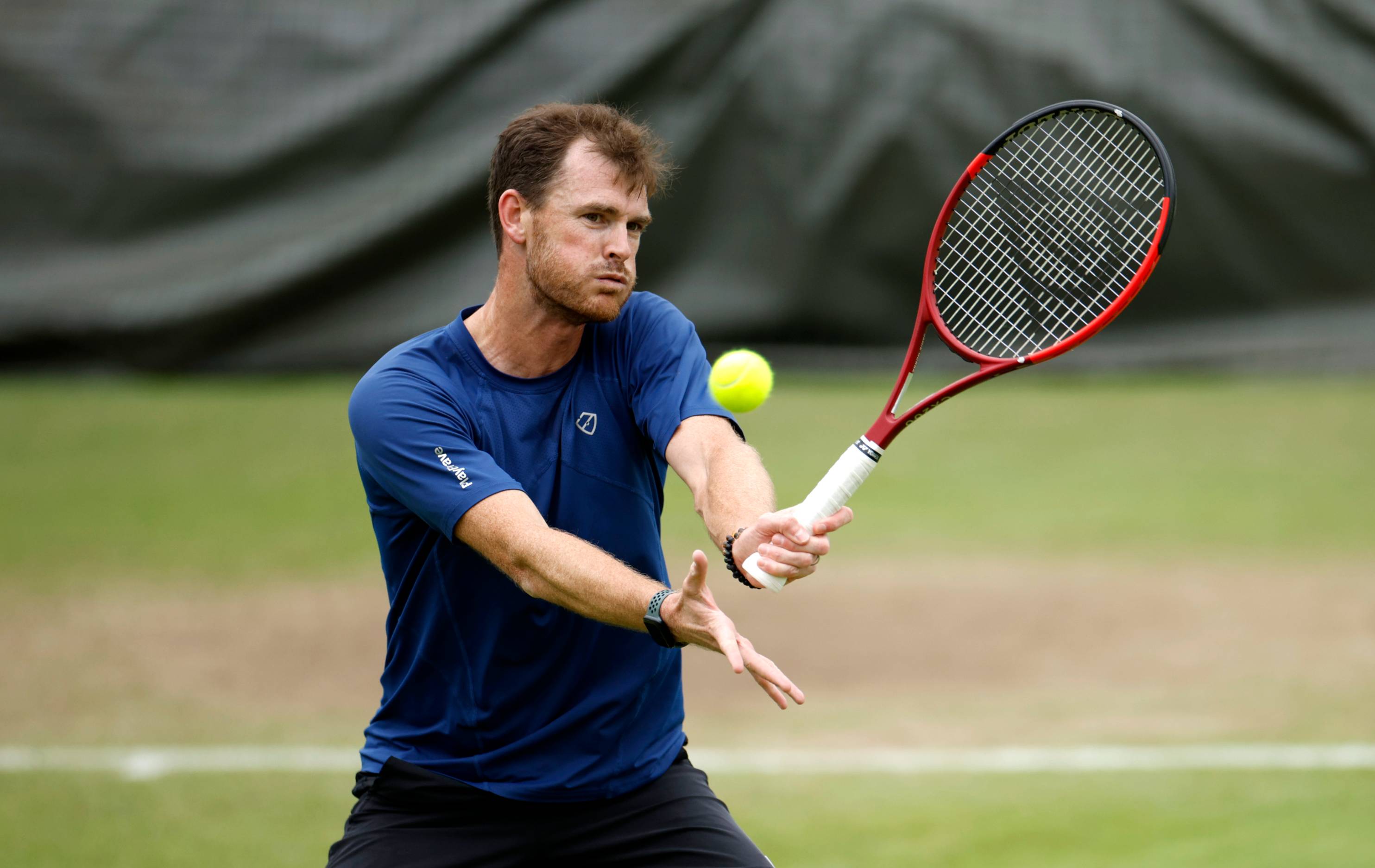 Jamie Murray hitting a volley during training at Wimbledon