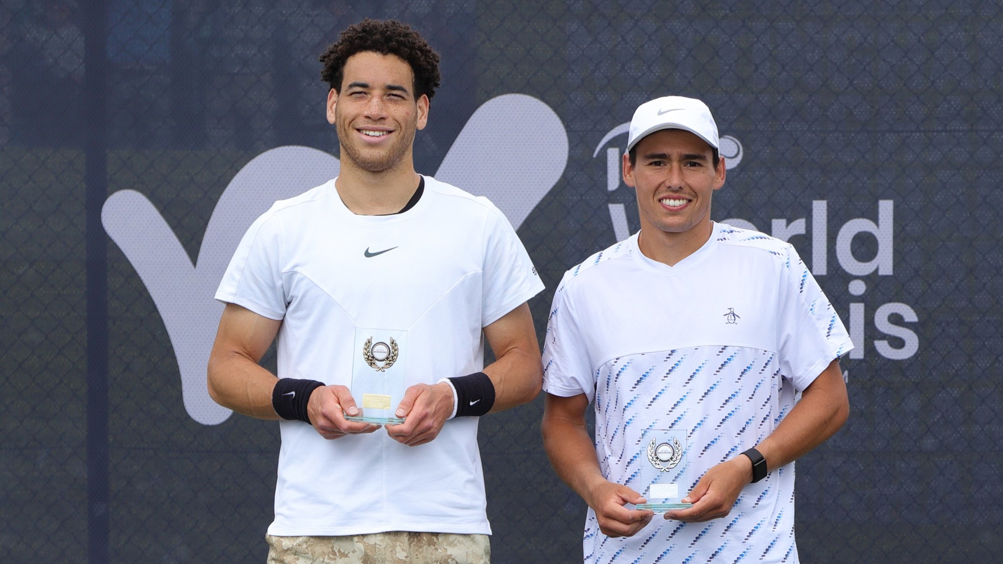 George Loffhagen holding his winners trophy at the Lexus Pro Series Nottingham alongside runner-up Charles Broom