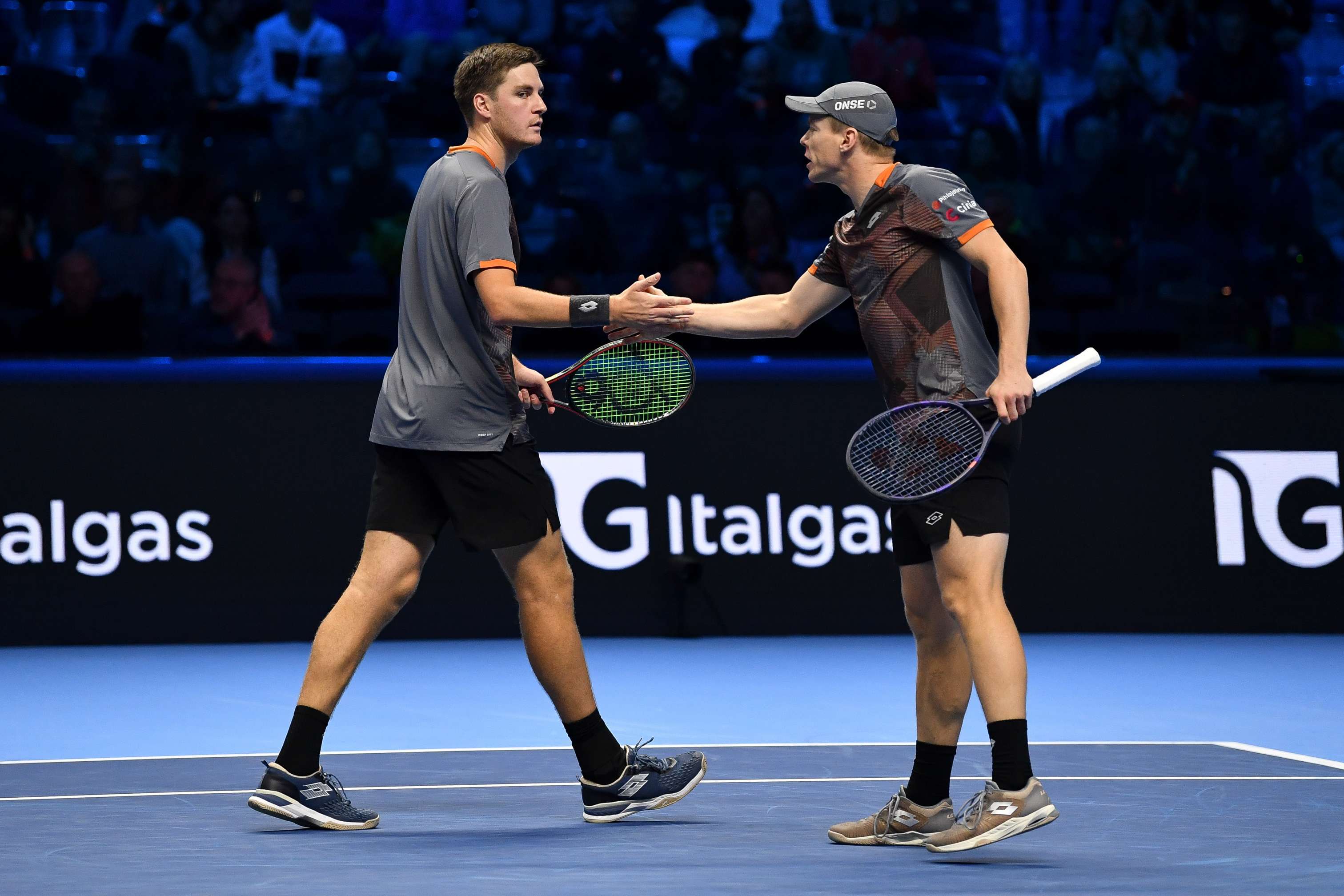 Henry Patten and Harri Heliovaara high five in the Nitto ATP Finals