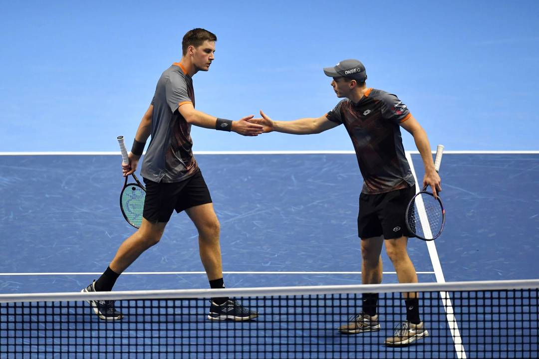 Henry Patten and Harri Heliovaara high five during the Nitto ATP Finals