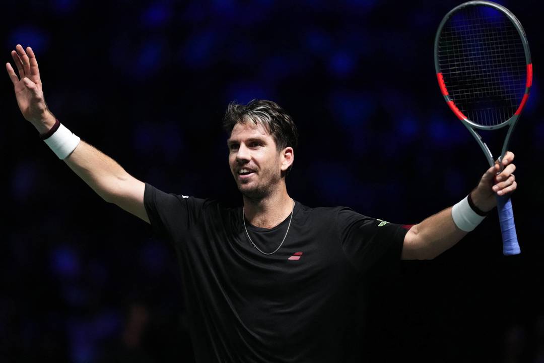 Cam Norrie celebrates defeating Carlos Alcaraz at the Rolex Paris Masters
