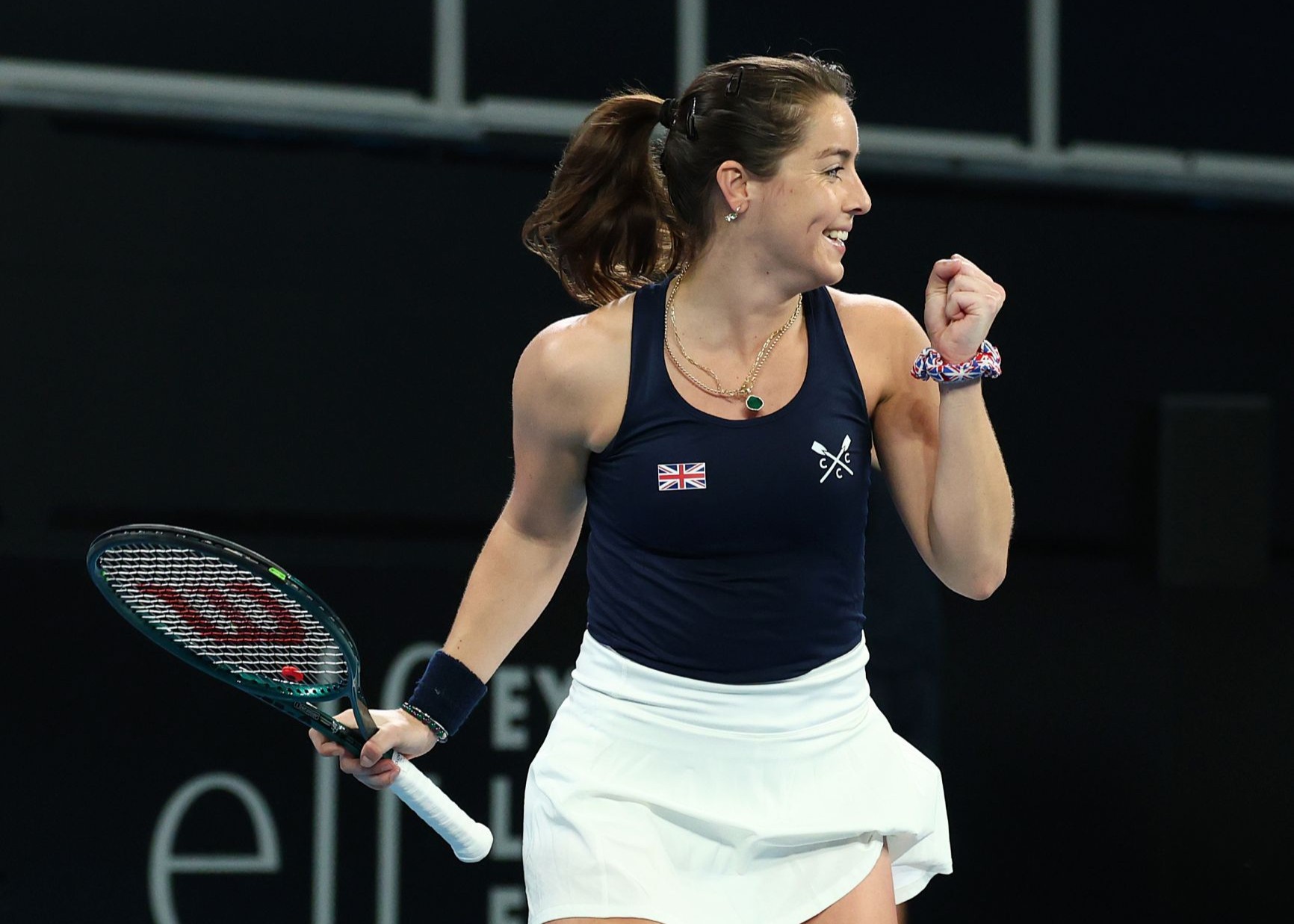 Jodie Burrage smiles and gives a fist pump in celebration at the Billie Jean King Cup