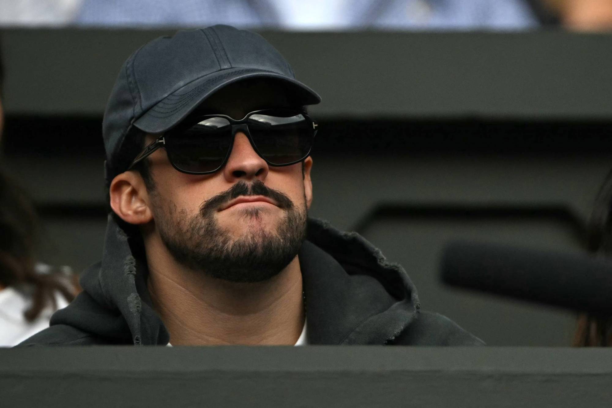 Puerto Rican rapper Bad Bunny sat watching Novak Djokovic on Centre Court at Wimbledon