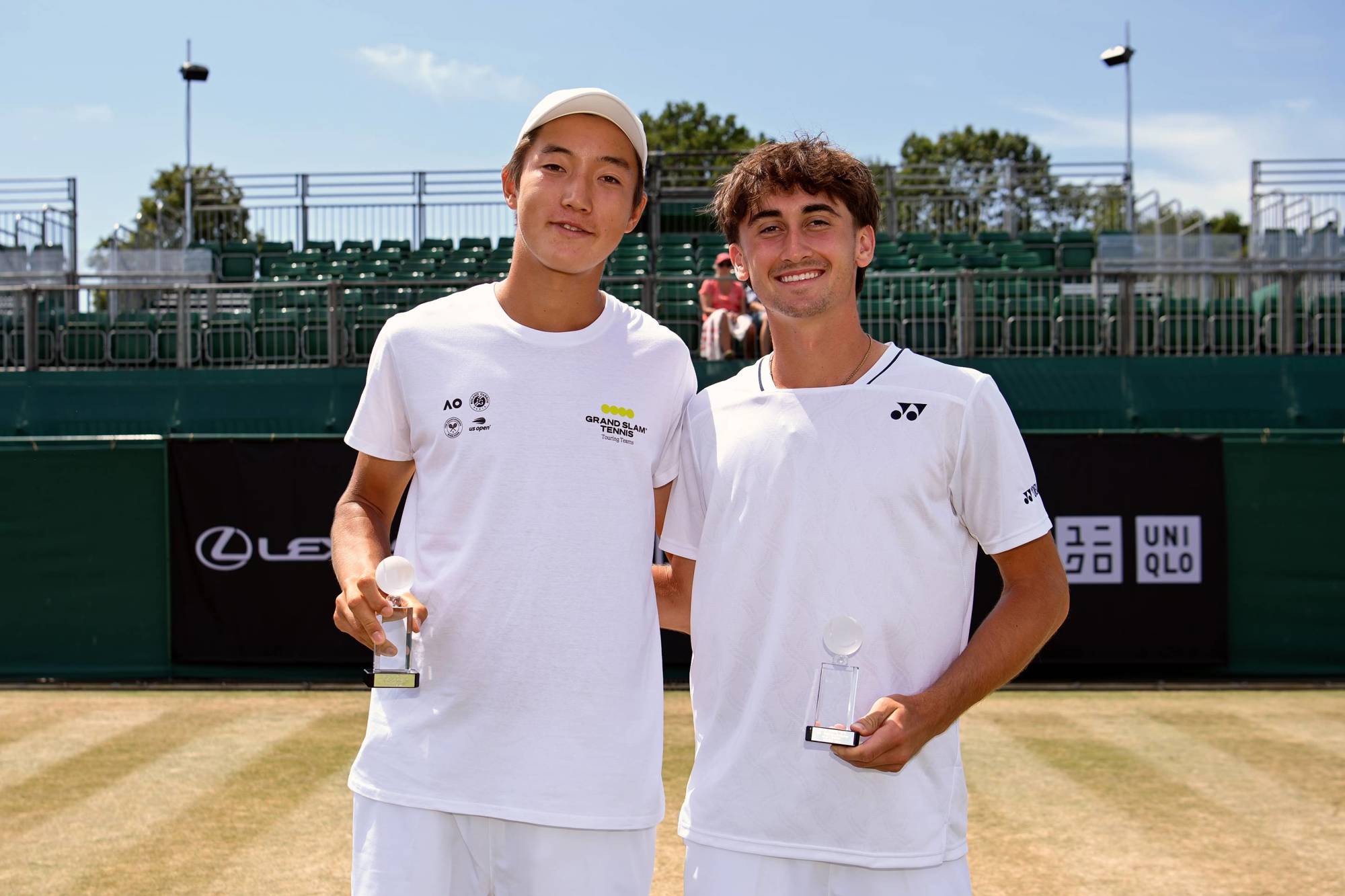 Jack Secord and Damir Zhalgasbay holding their runners-up trophies at the Lexus British Open