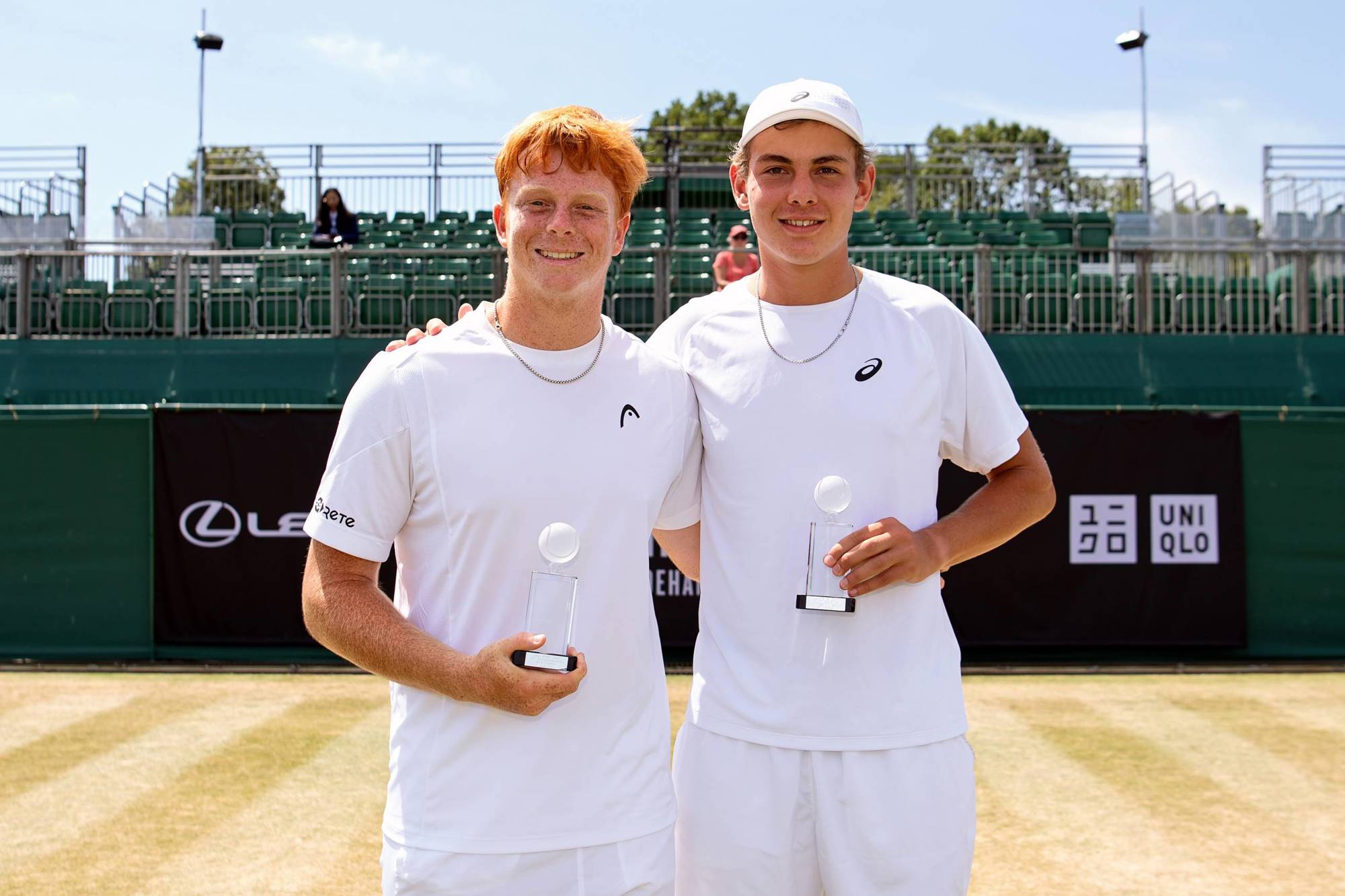 Germany's Jamie Mackenzie and Vincent Reisach holding their Lexus British Open Roehampton doubles titles 