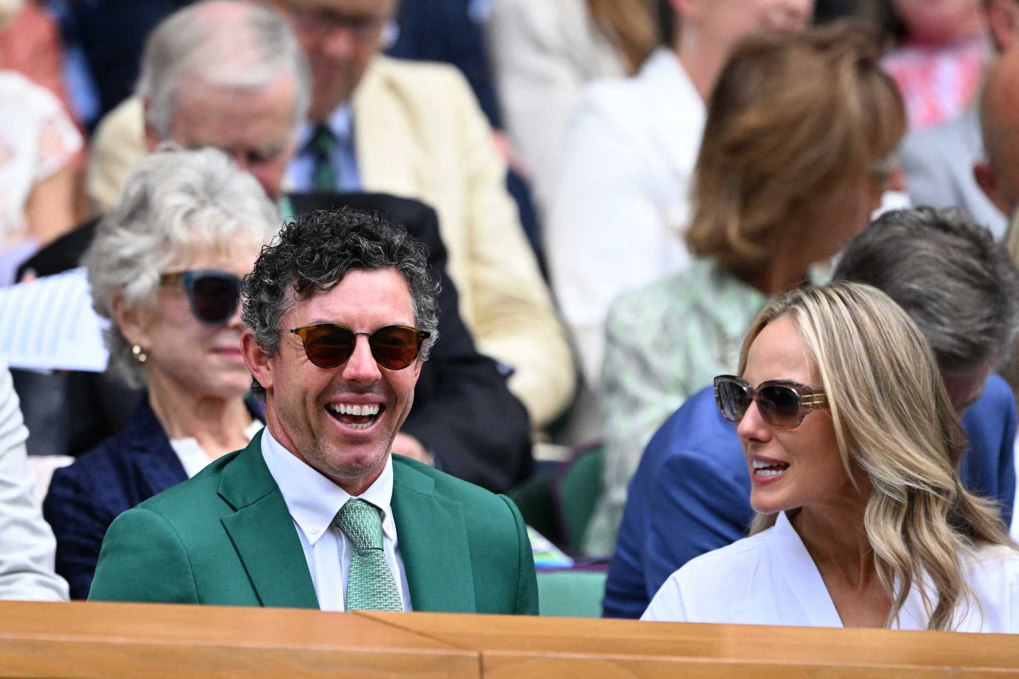 Irish golfer Rory McIlroy smiling in the Royal Box on Centre Court