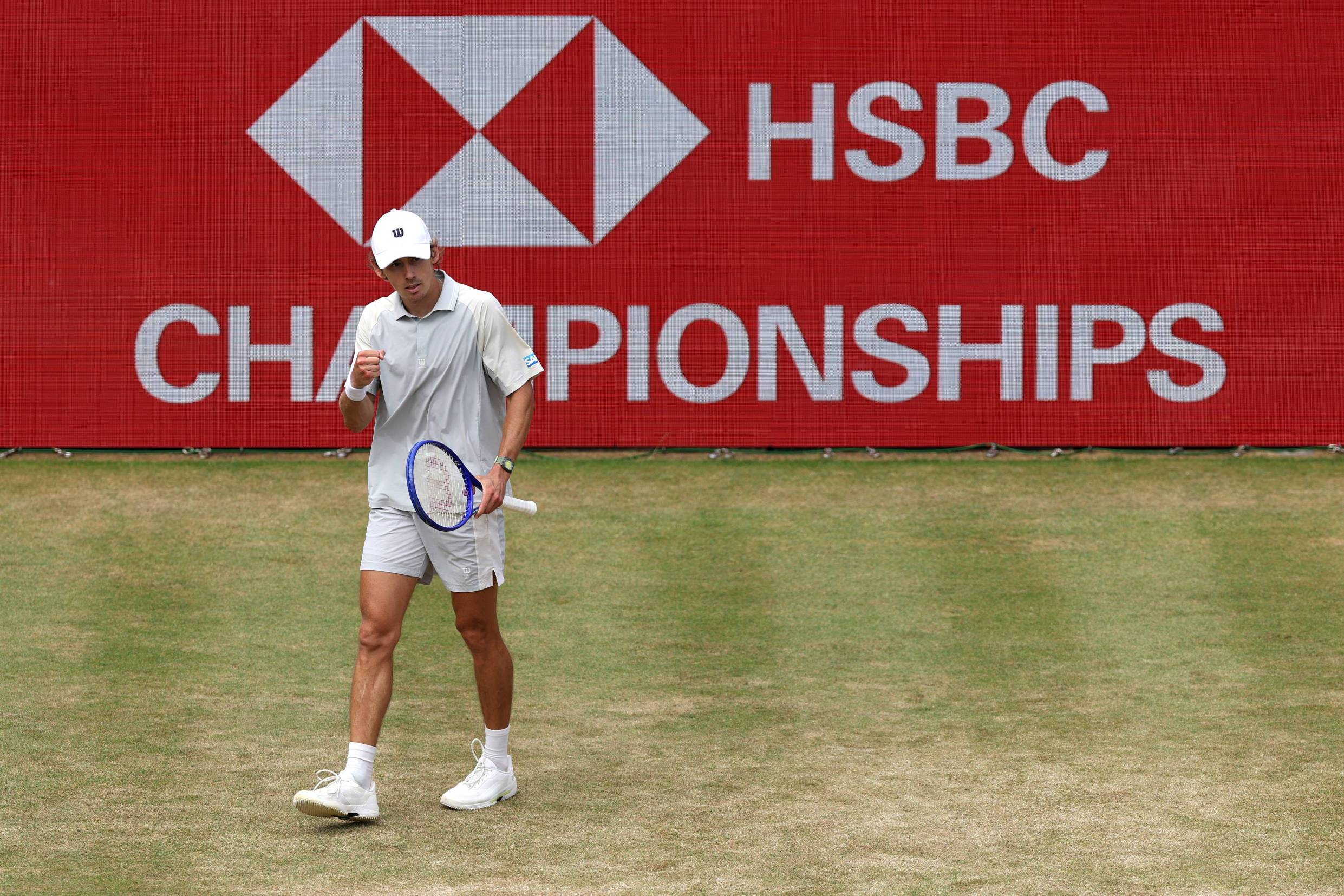 Australian tennis player Alex de Minaur clenching his fist on court at the HSBC Championships 