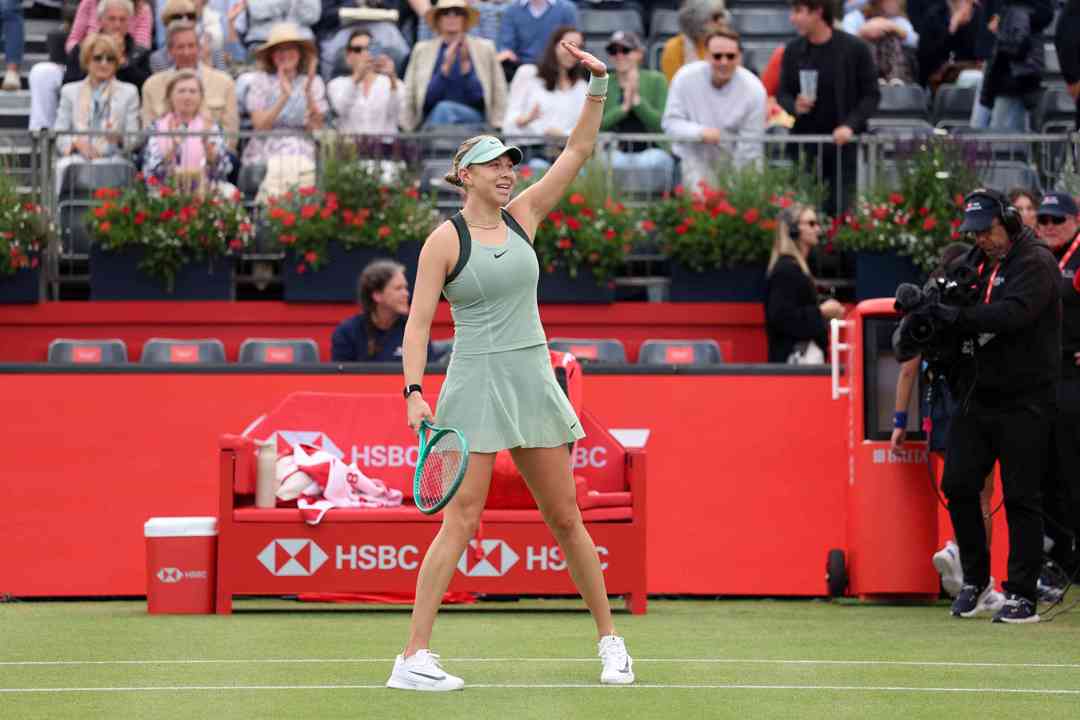 American tennis player Amanda Anisimova waving to the crowd on court after winning her first round match at the HSBC Championships