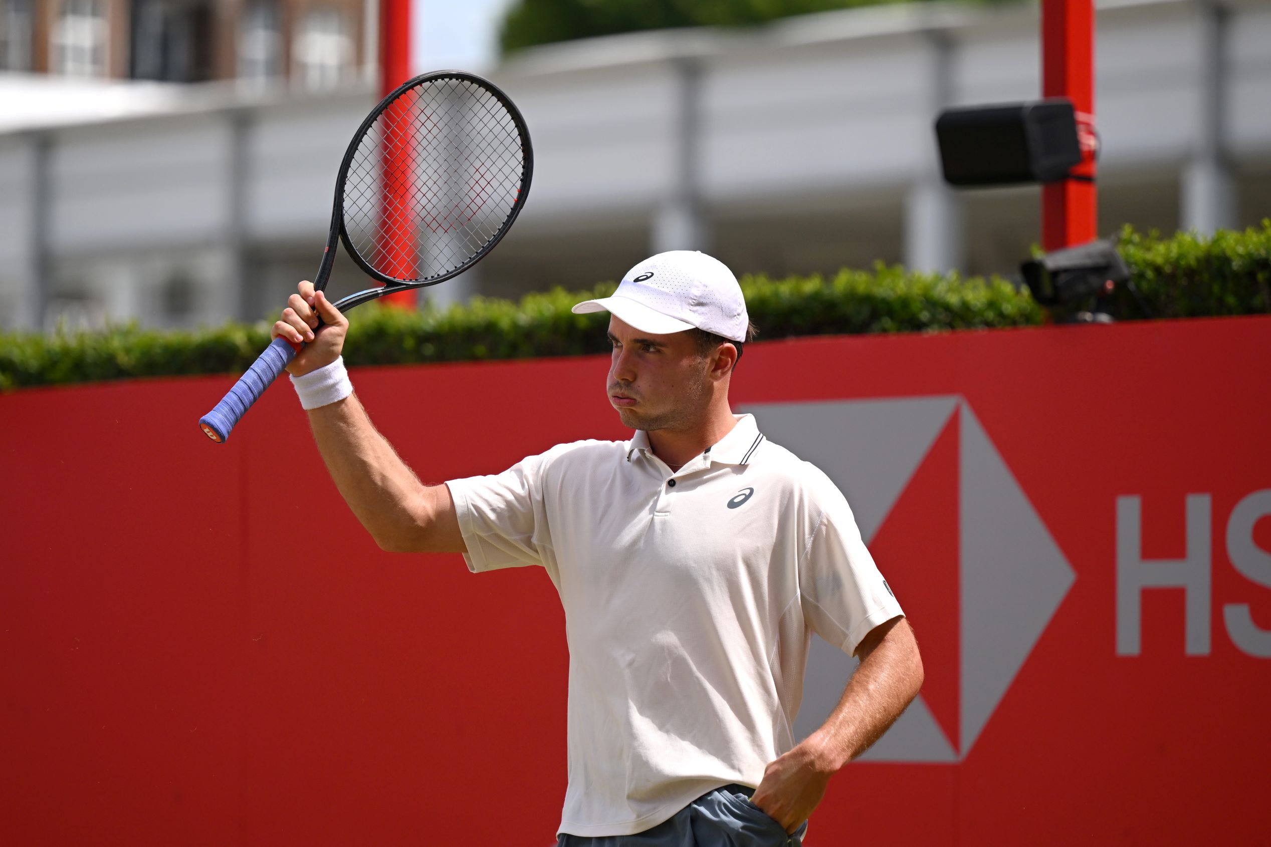 Arthur Fery holding his tennis racket up in the air on court at the HSBC Championships