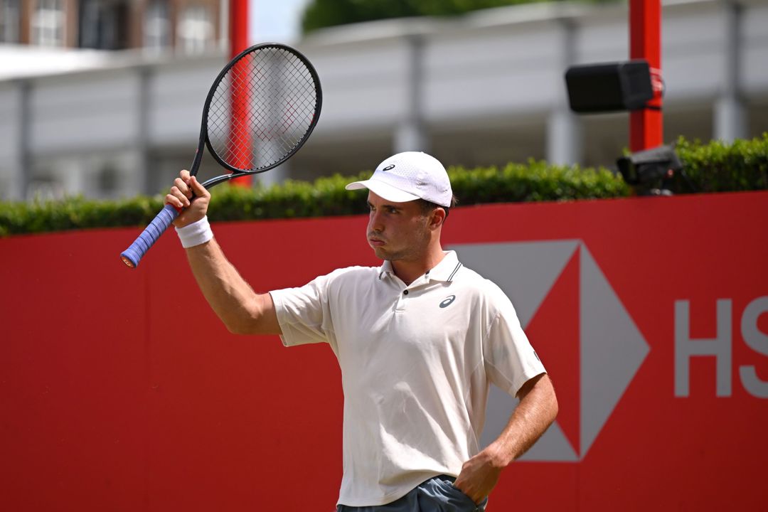 Arthur Fery holding his tennis racket up in the air on court at the HSBC Championships
