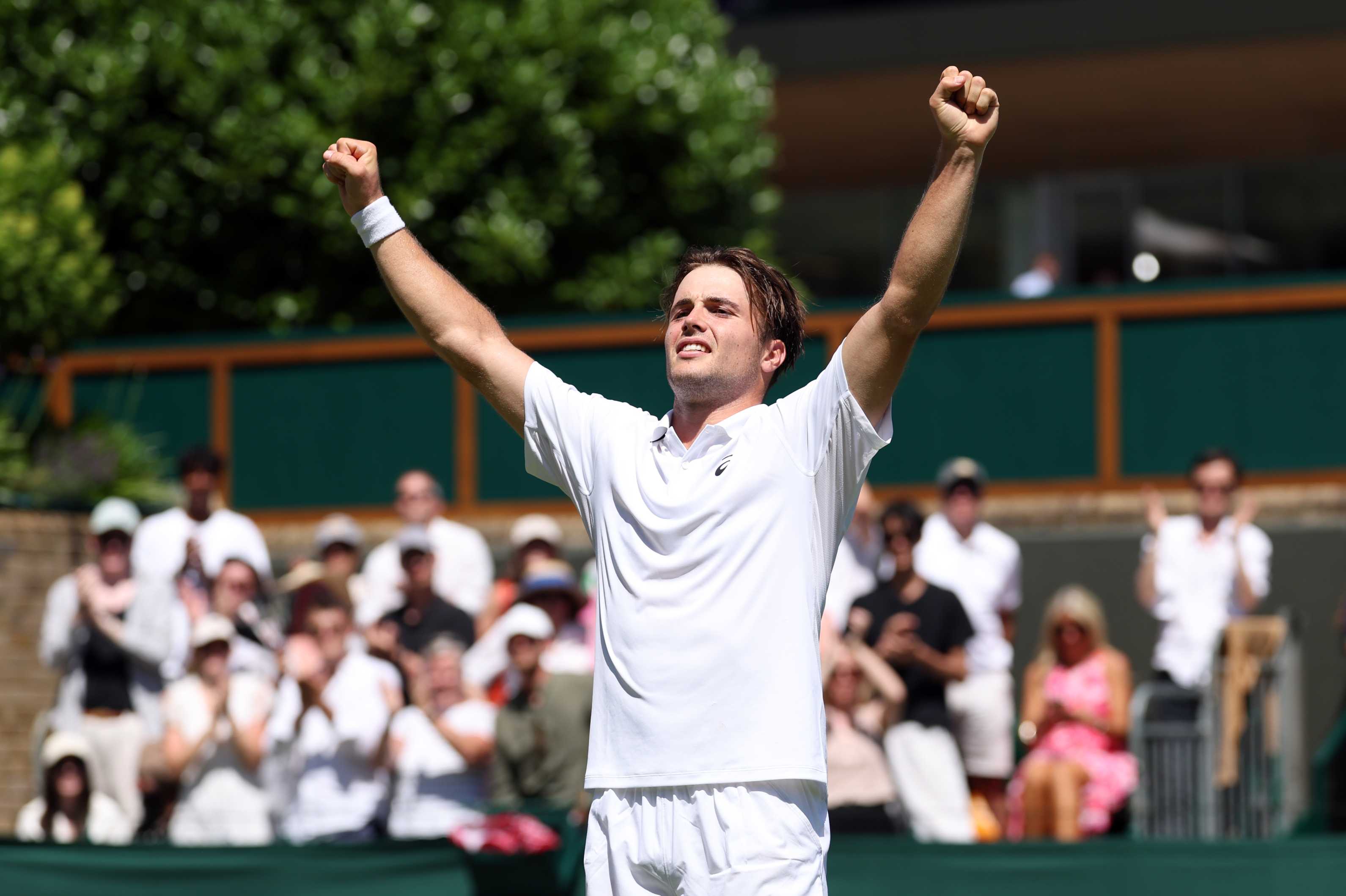 Arthur Fery cheers in celebration after reaching the third round of Wimbledon