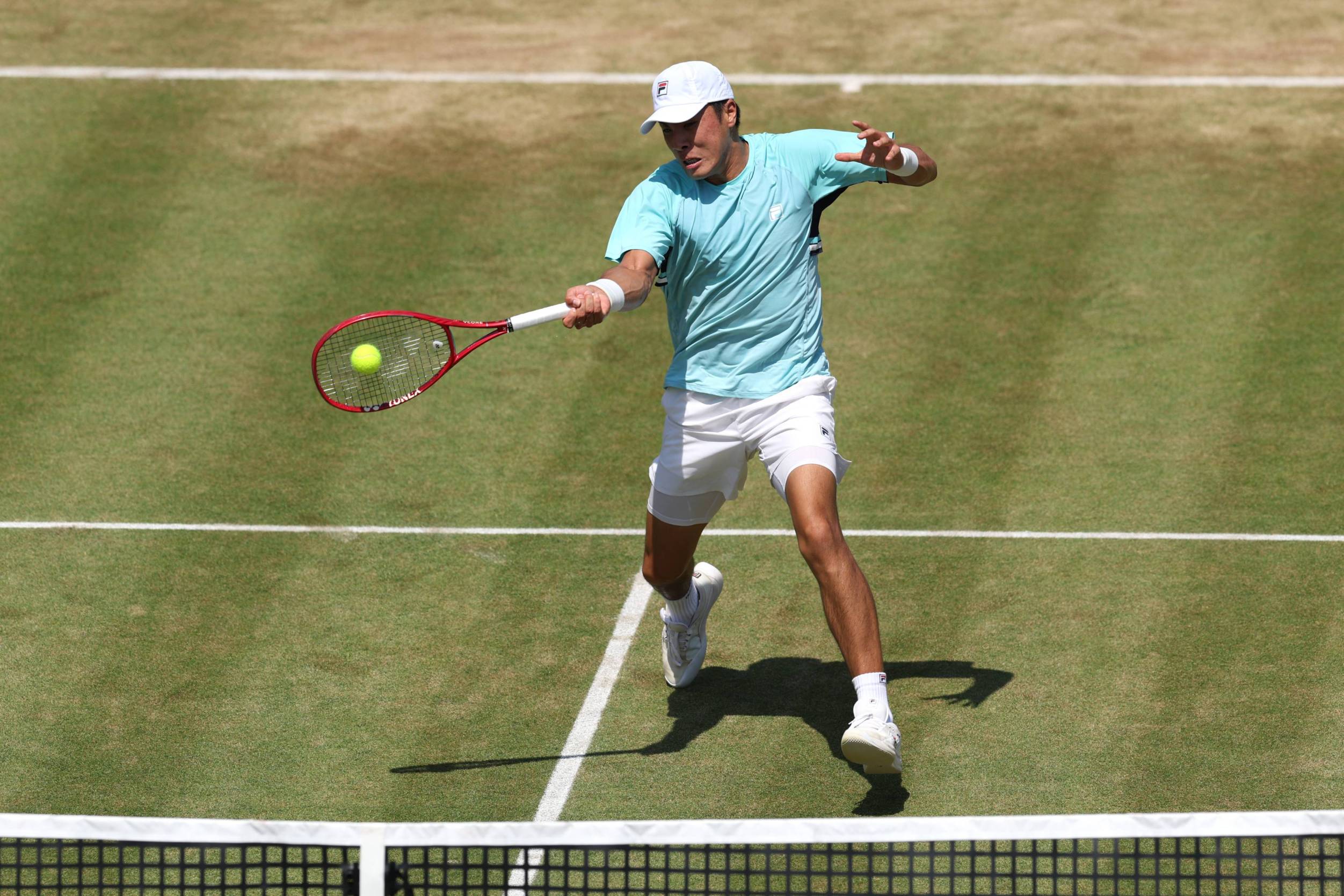 Brandon Nakashima hitting a forehand on court at the HSBC Championships
