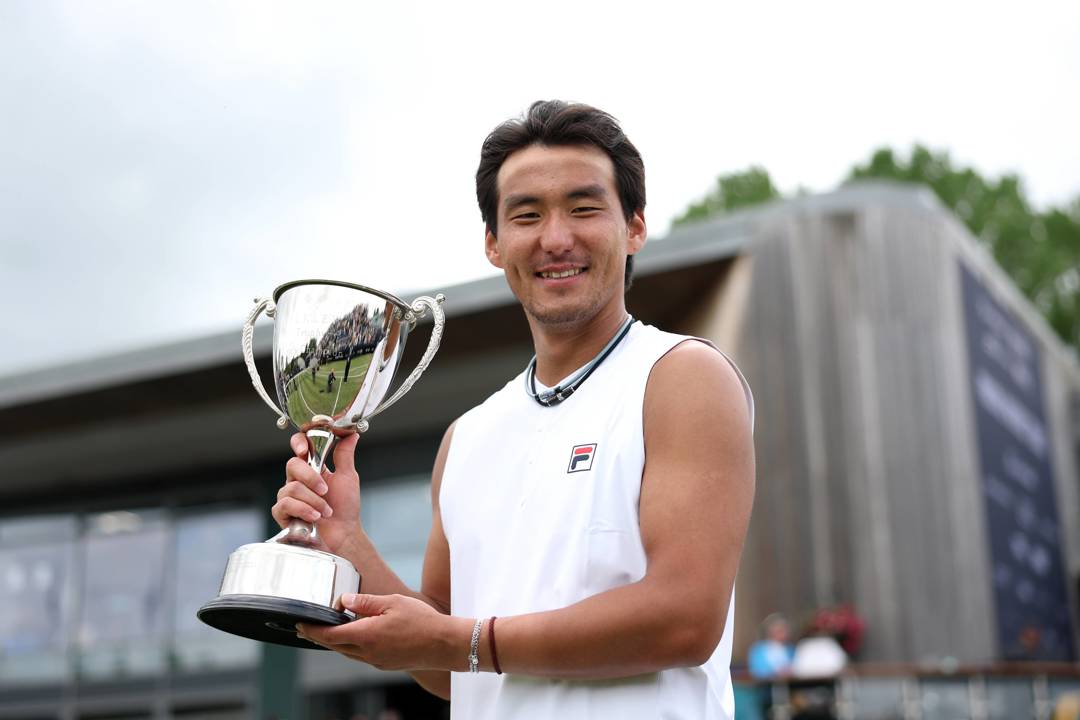 Yunchaokete Bu smiling while holding his winners trophy at the Lexus Ilkley Open 