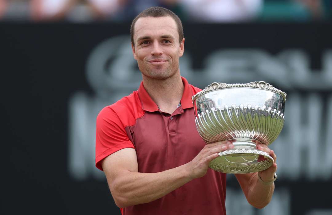 Christopher O'Connell smiling while holding the Lexus Nottingham Open trophy 