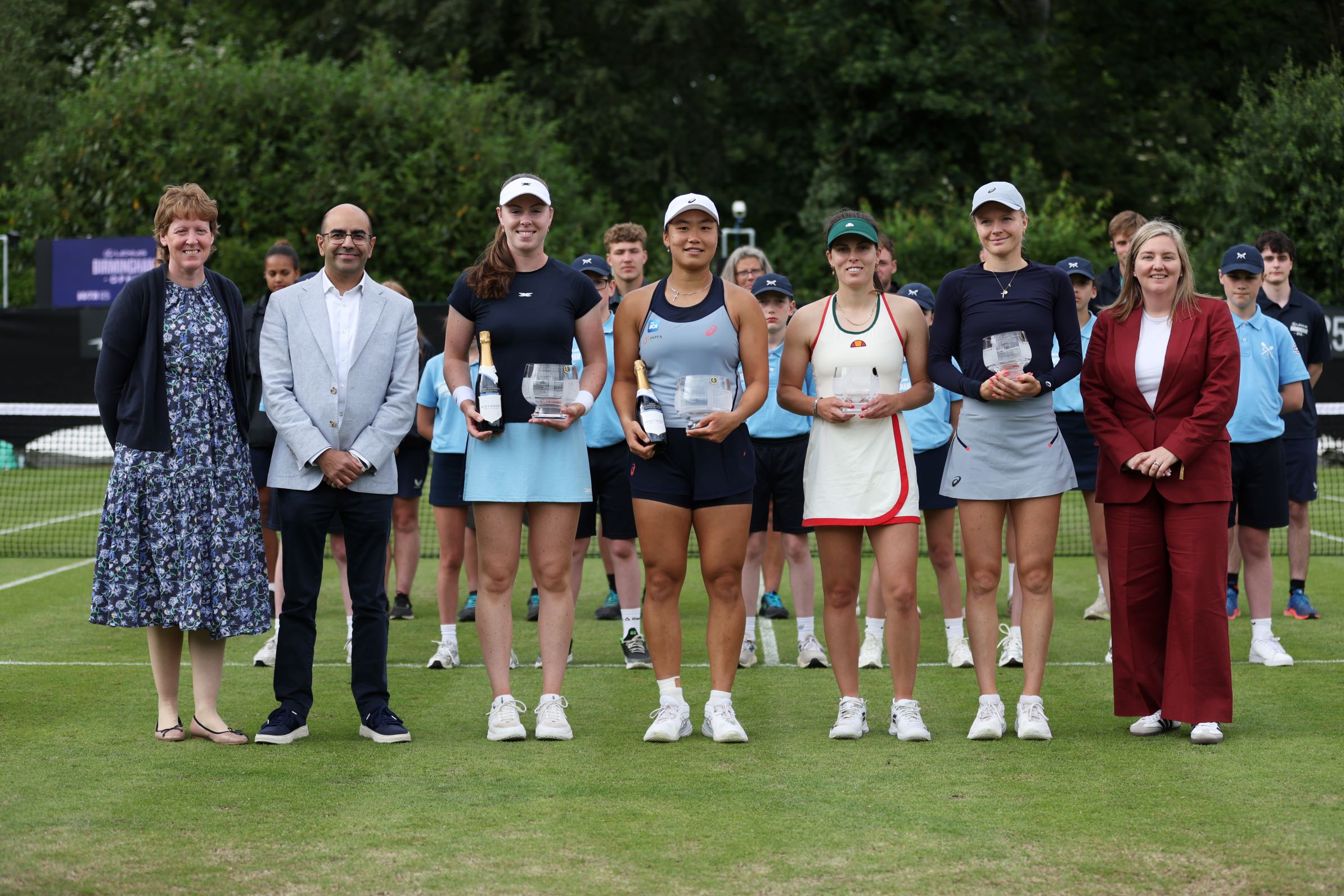 Harriet Dart and Maia Lumsden smiling while holding their trophies at the Lexus Birmingham Open