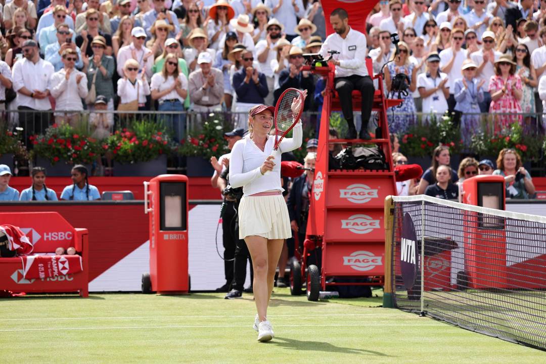 Donna Vekic smiling while tapping her tennis racket on court at the HSBC Championships