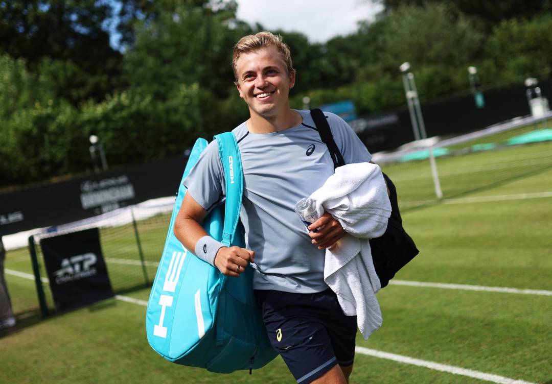 Felix Gill smiles walking off court after a win at the Lexus Birmingham Open