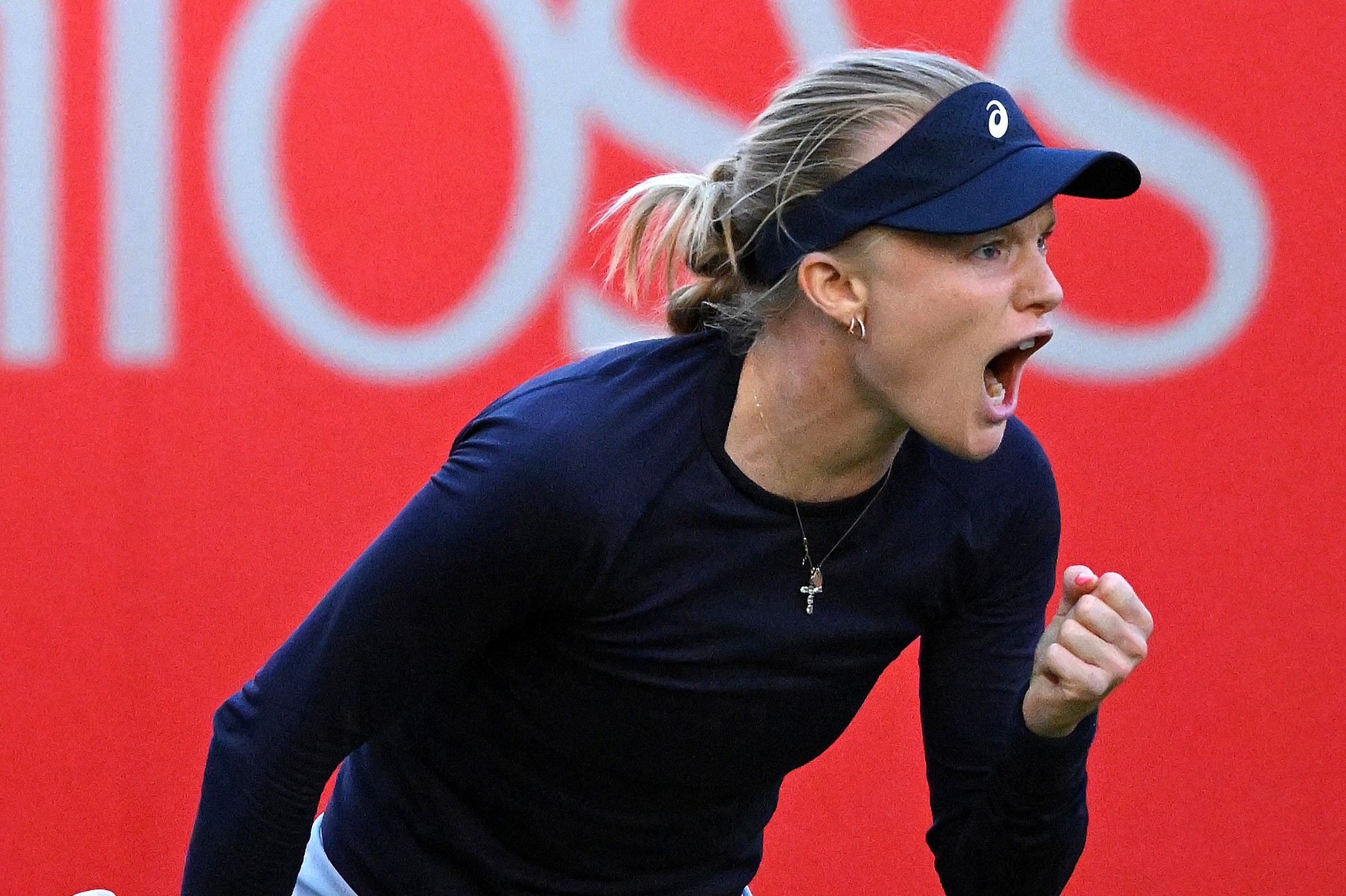 Harriet Dart roars in celebration after a round one win at the HSBC Championships