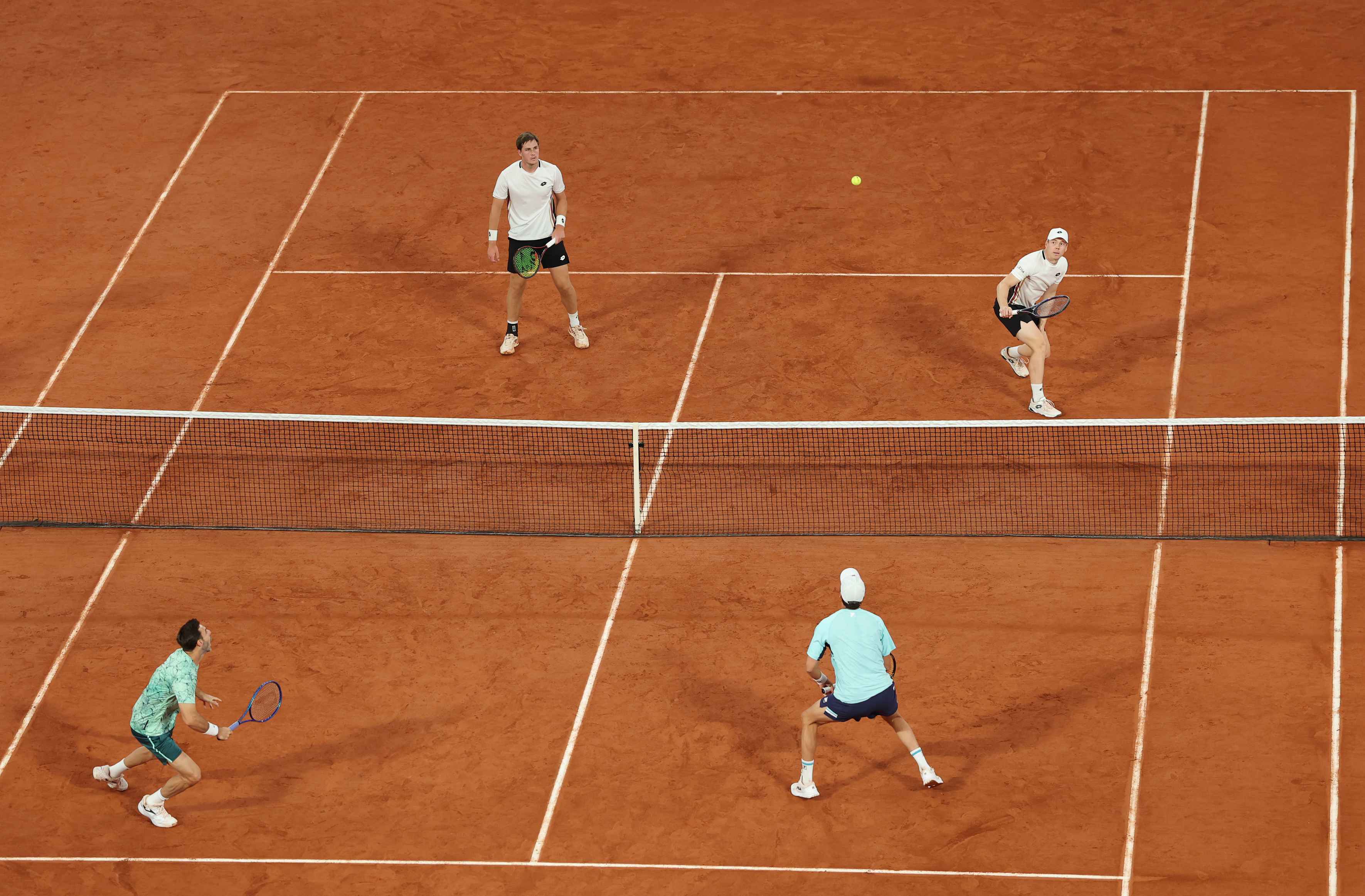 Henry Patten and Harri Heliovaara during a rally in the 2026 Roland Garros final