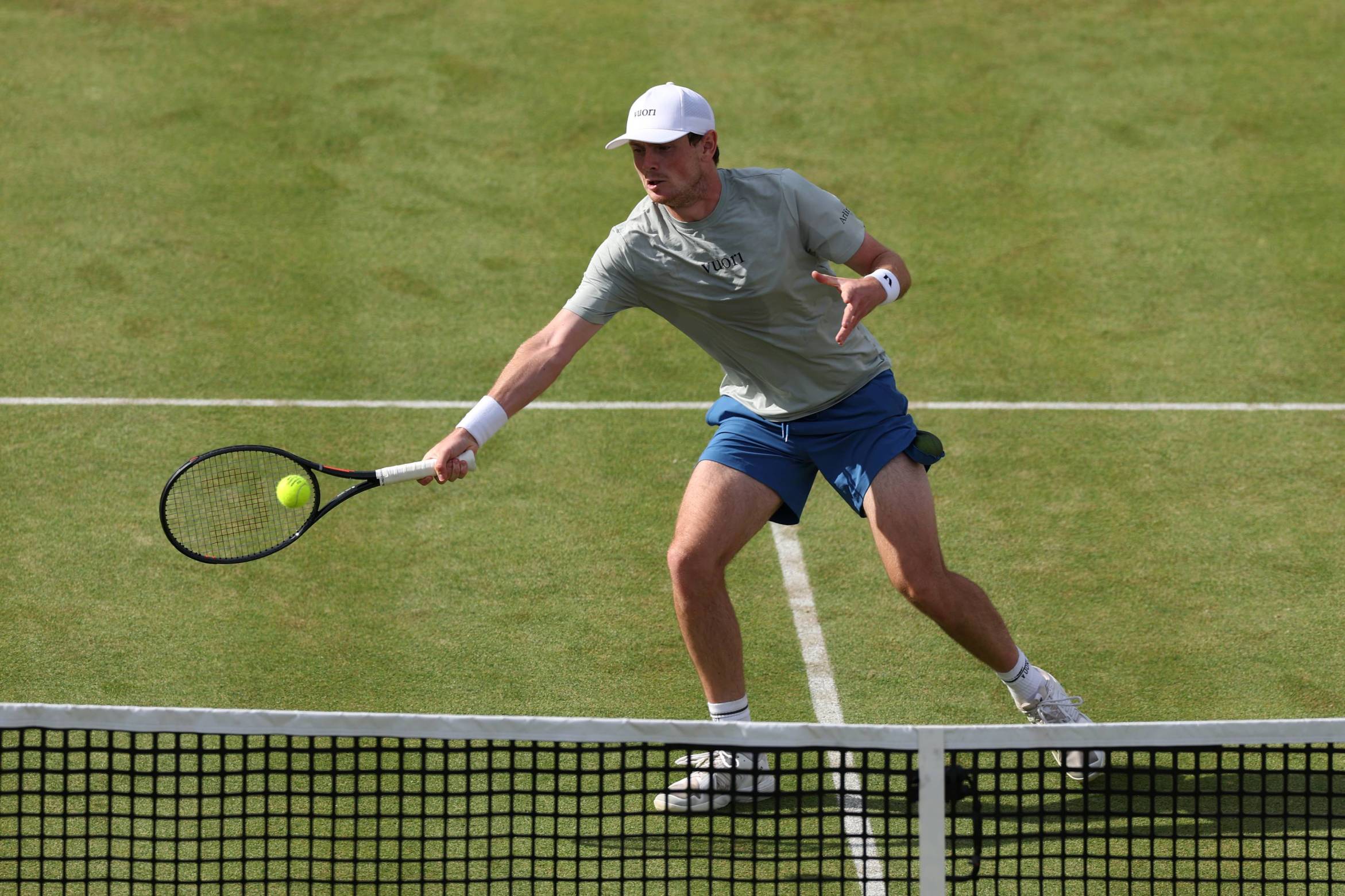 Jack Pinnington Jones reaching to hit a forehand on court at the HSBC Championships 