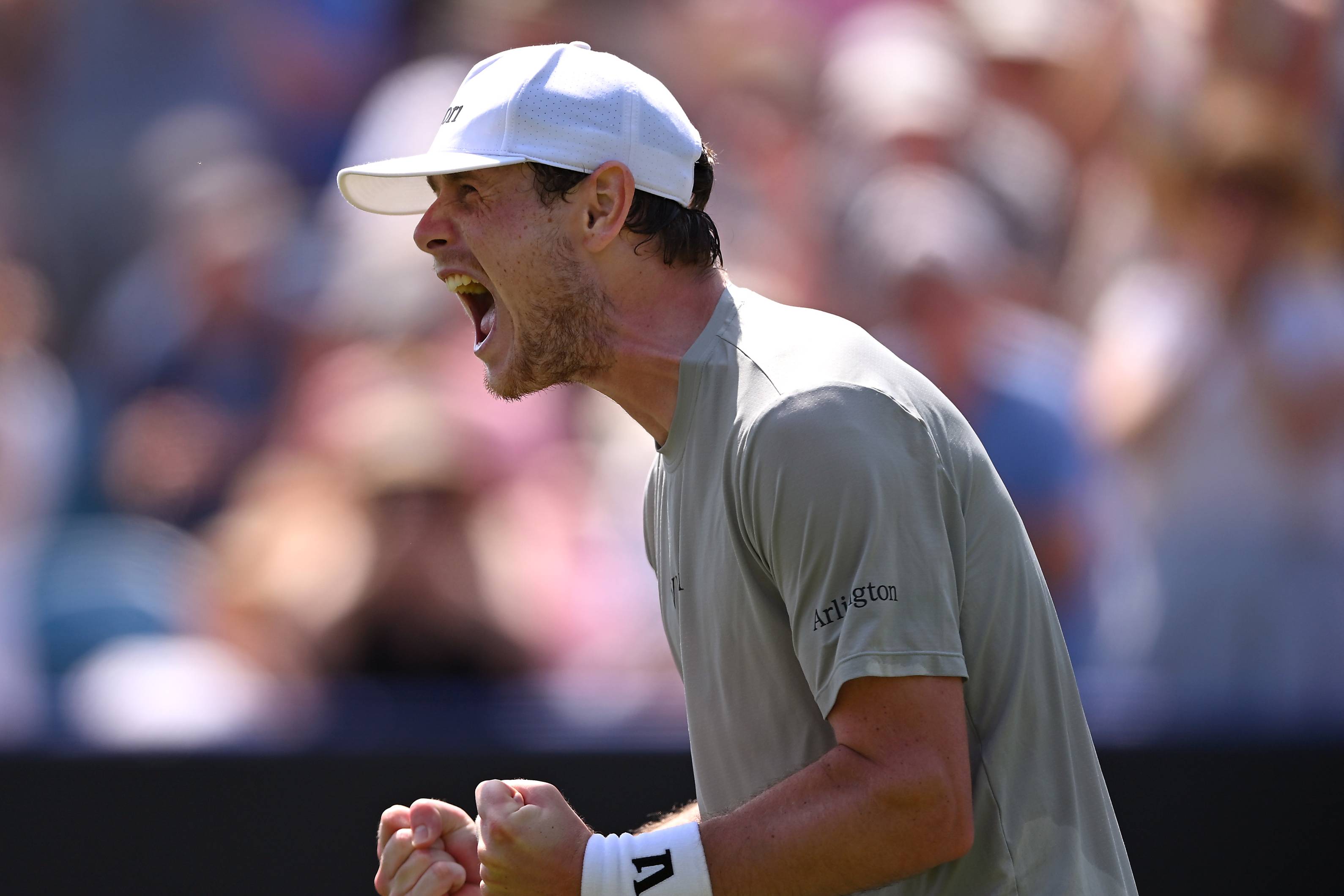 Jack Pinnington Jones clenching both fists while on court at the Lexus Eastbourne Open