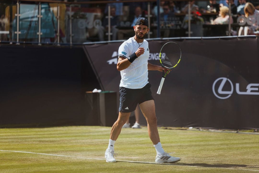 British tennis player Jacob Fearnley pumping his fist in celebration at the Lexus Ilkley Open