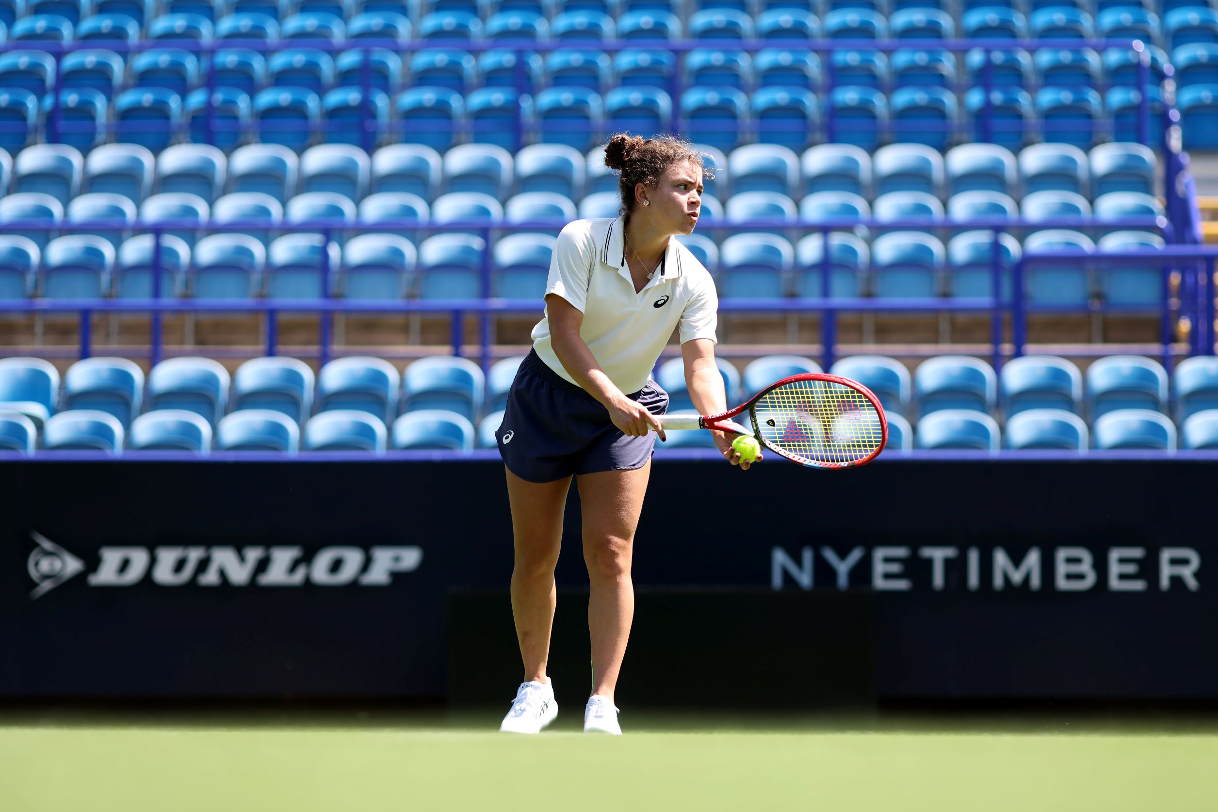 Jasmine Paolini about to hit a serve in practice at the Lexus Eastbourne Open