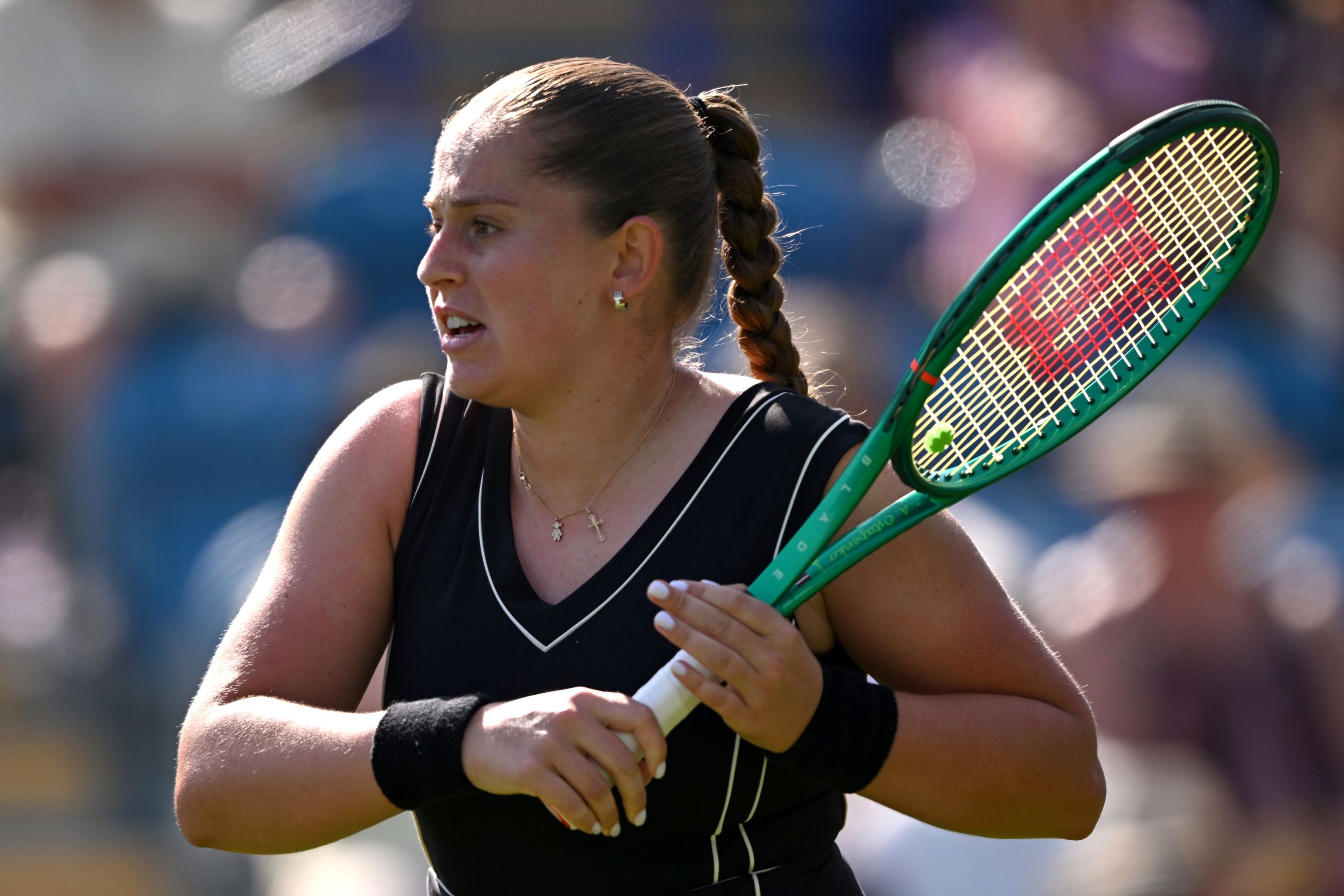 Jelena Ostapenko with her racket across her body after having hit a forehand at the Lexus Eastbourne Open