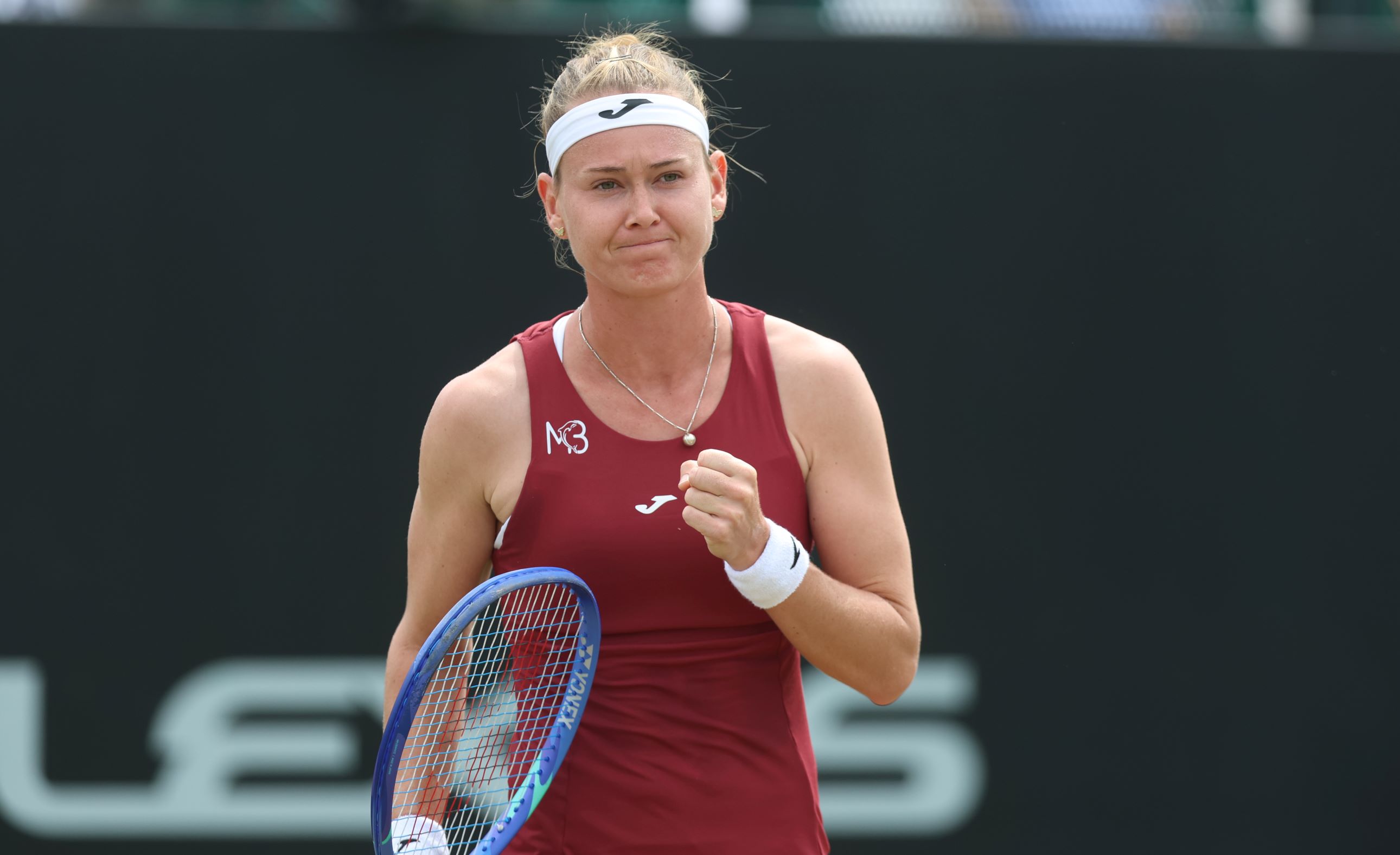 Maria Bouzkova raising her fist in celebration after winning her second round match at the Lexus Nottingham Open