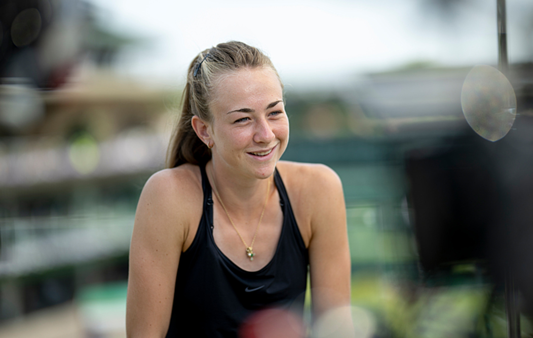 Mika Stojsavljevic smiling during media duties at Wimbledon