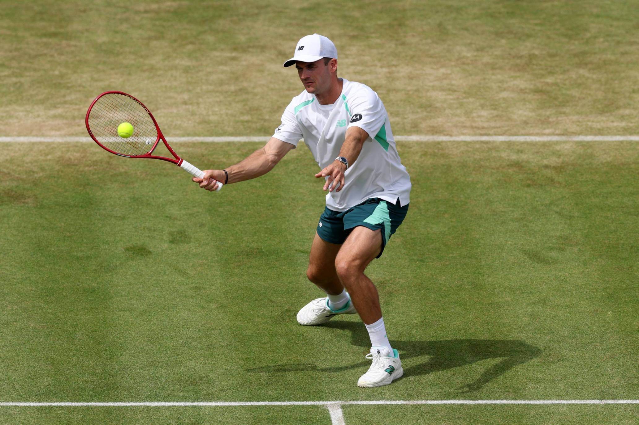 Tommy Paul hitting a forehand on court at the HSBC CHmapionships
