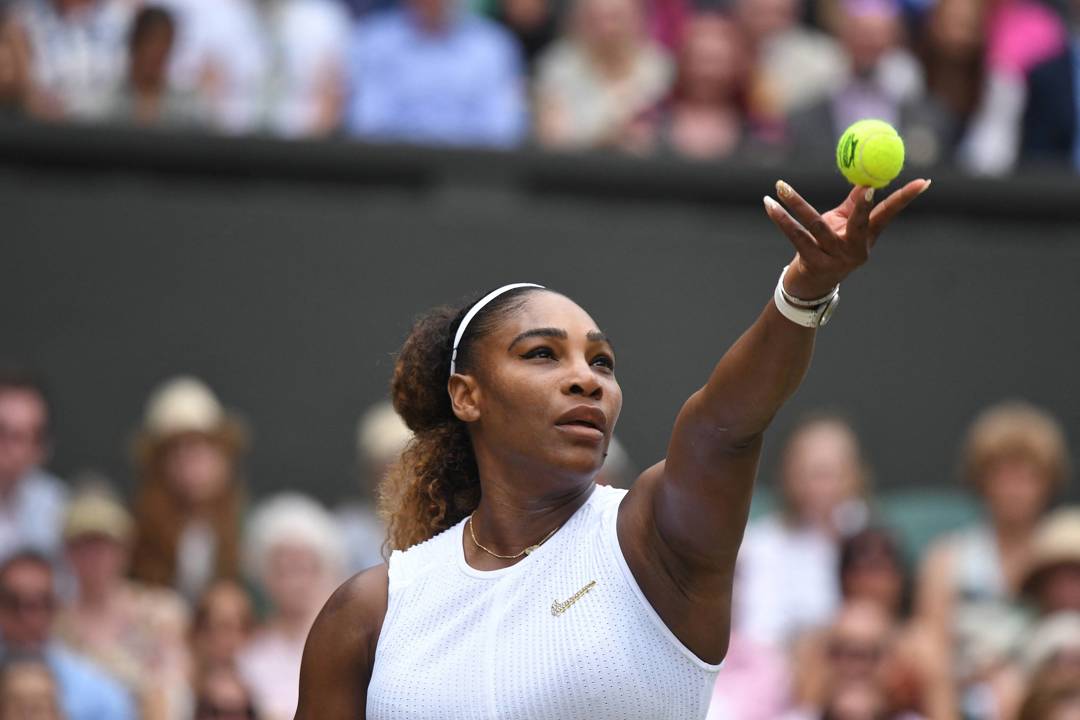 Serena Williams lines up a serve at Wimbledon