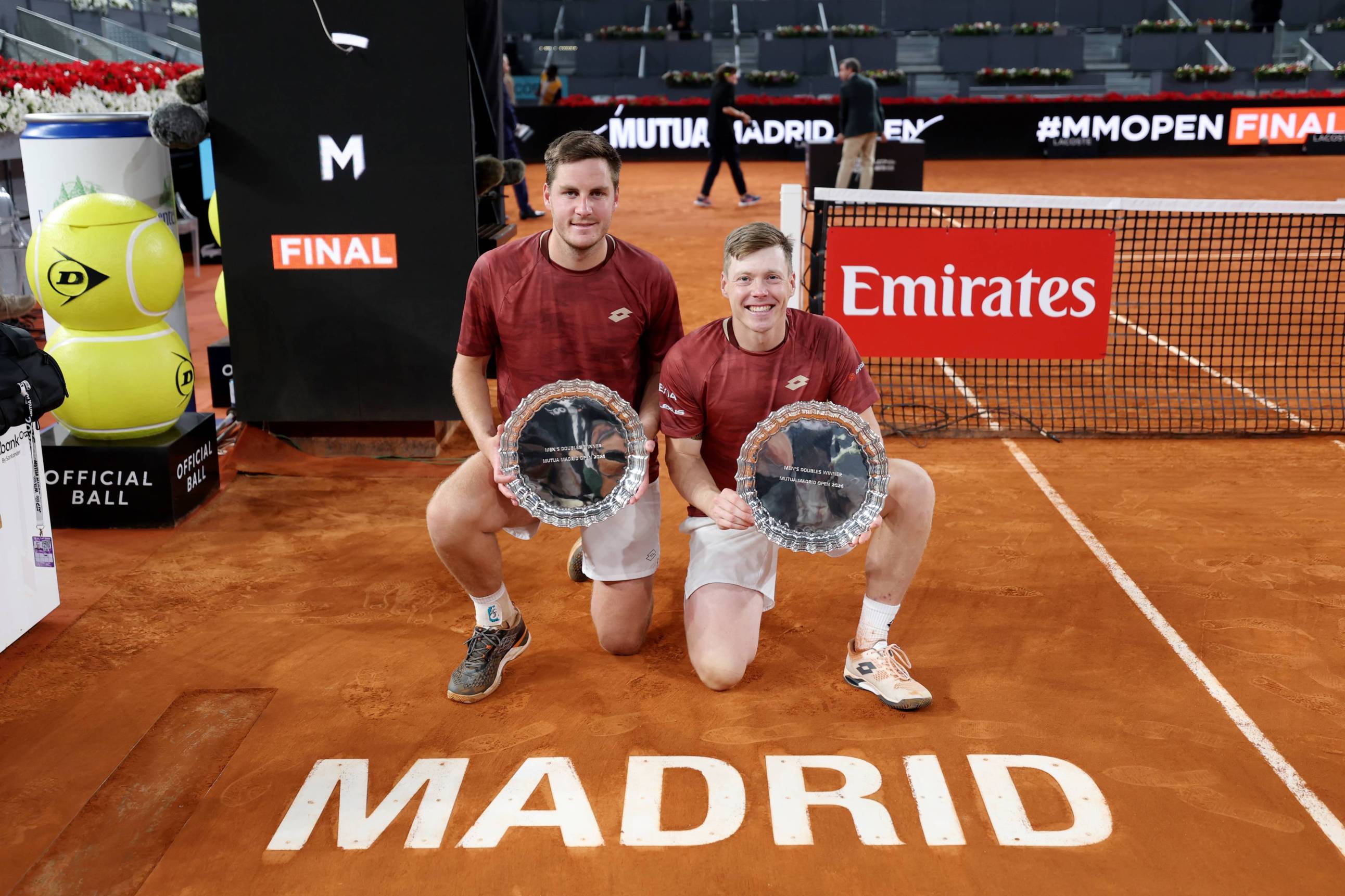 Henry Patten and Harri Heliovaara holding the Mutua Madrid Open title