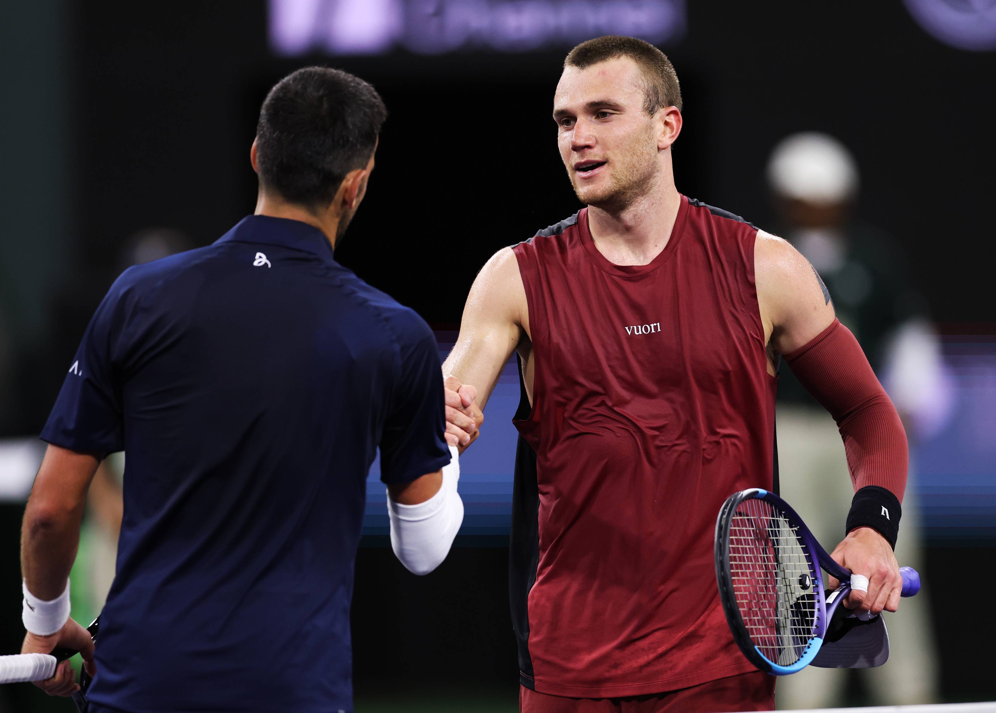Jack Draper shakes hands with Novak Djokovic after his fourth round win in Indian Wells
