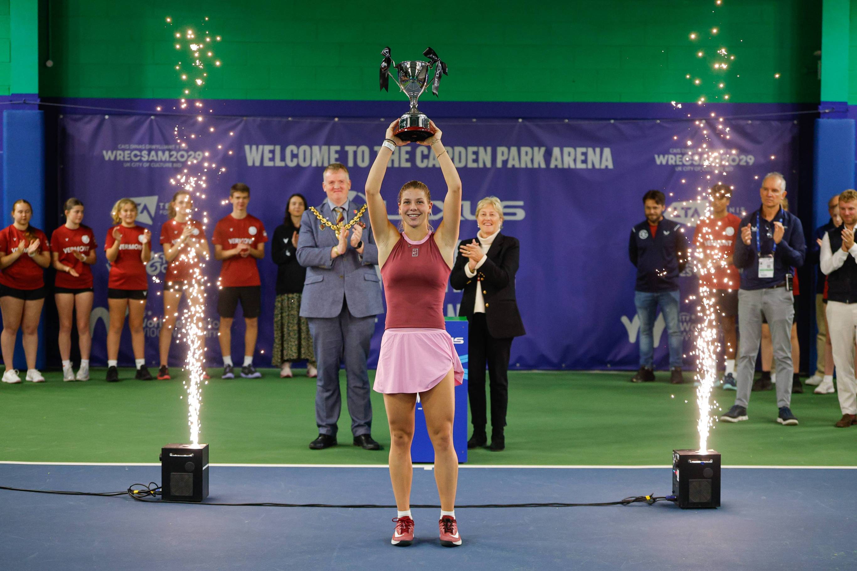 British tennis player Hannah Klugman holding the Lexus Wrexham Open title