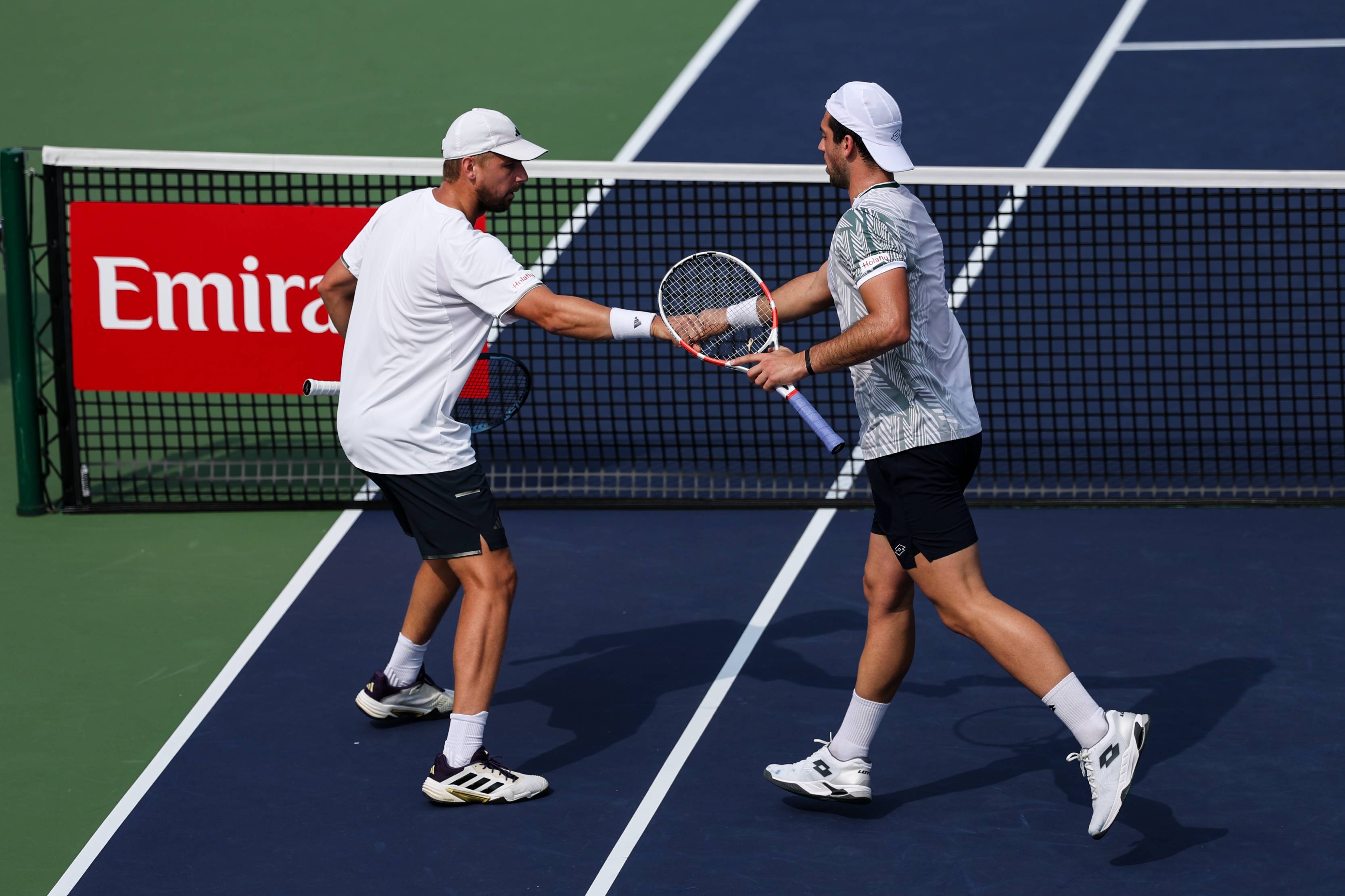 British doubles players Lloyd Glasspool and Julian Cash high five at the Rolex Shanghai Masters
